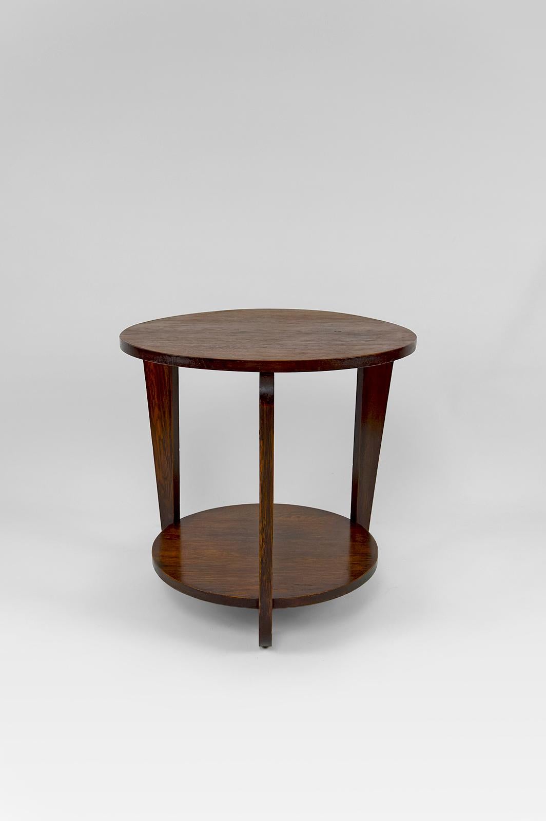 In the style of André Sornay's productions.

Tripod pedestal table with 2 trays
Art Deco.
France, Circa 1930.
In smoked oak.

In excellent condition.

Dimensions:
height 58 cm
diameter 67 cm

(Low shelf: height 12 cm, diameter 48 cm)