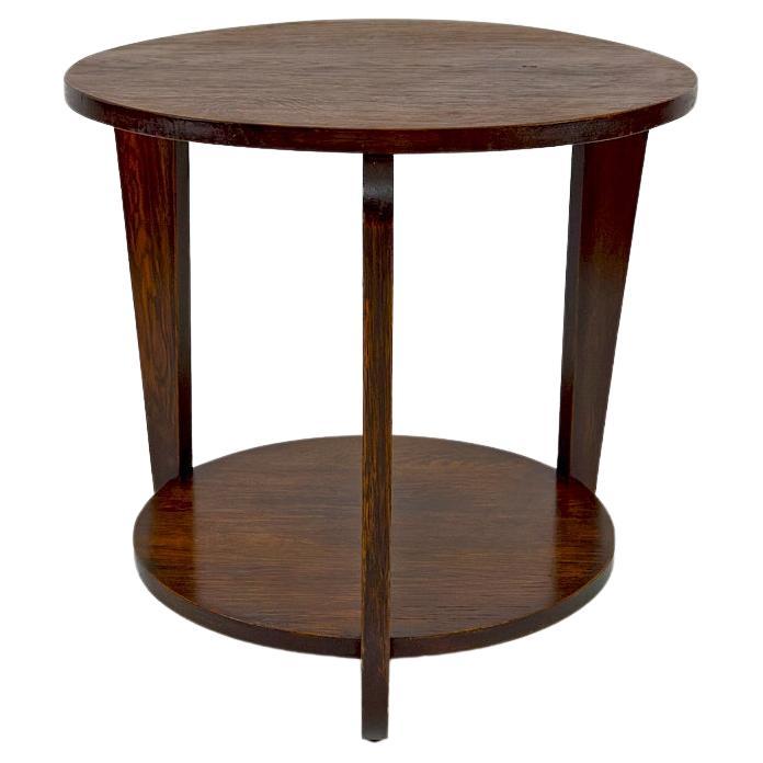 Modernist Art Deco round pedestal table in patinated oak, France, Circa 1930 For Sale