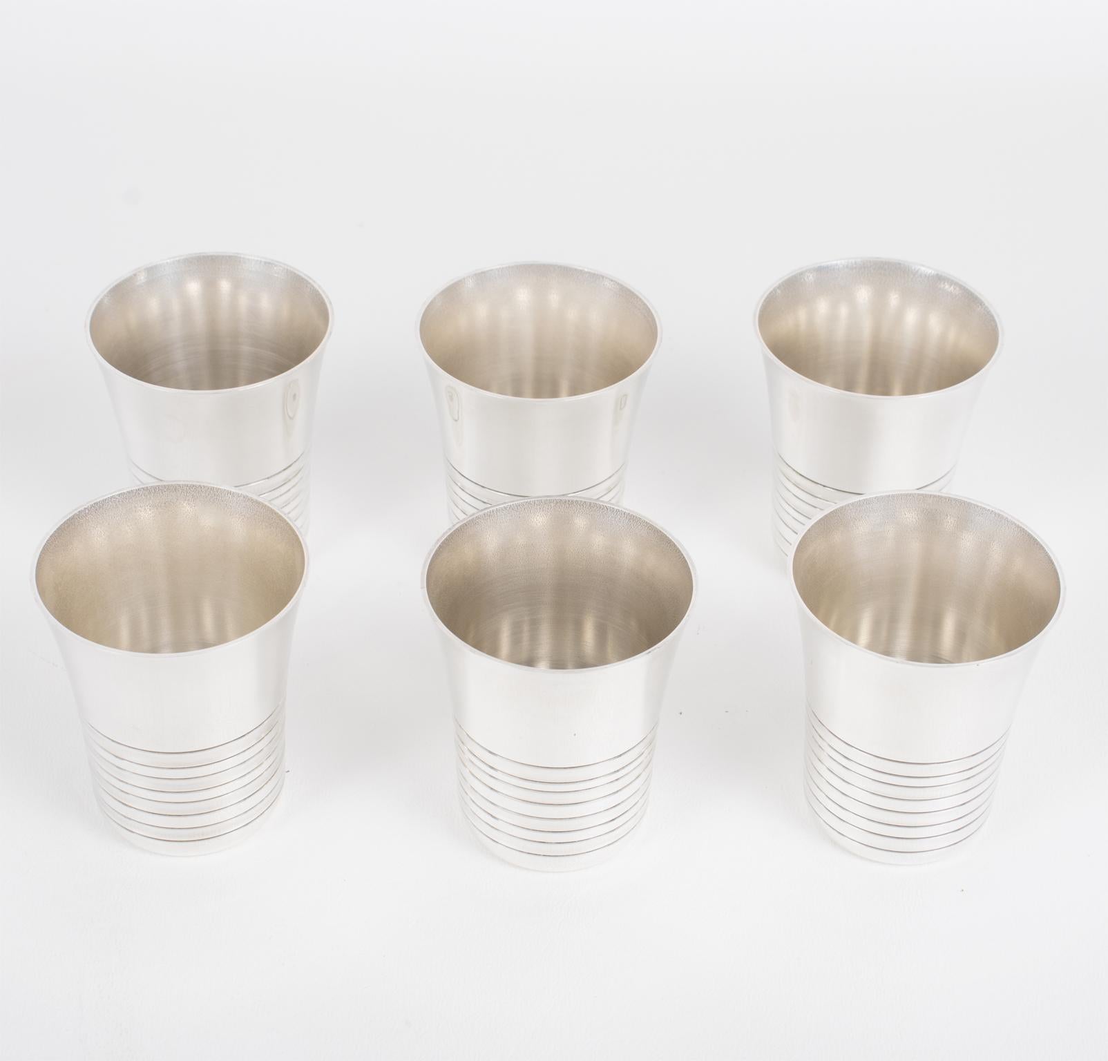 This elegant Art Deco silver plate barware serving set was crafted in France in the 1940s by Silversmith Fabiora, Paris. The bar set consists of six silver plate cocktail cordial cups or shot glasses with a stunning streamlined geometric design.