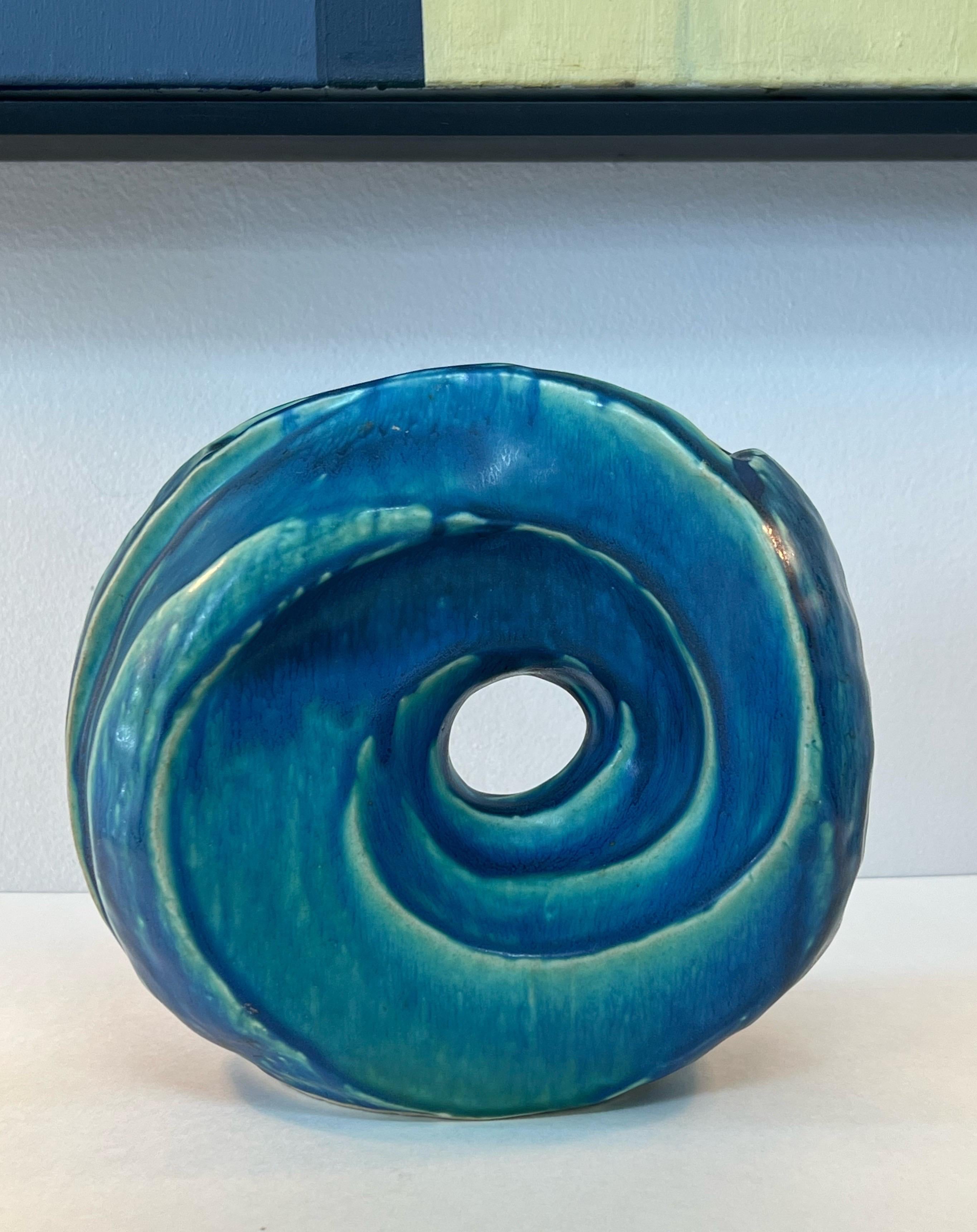 A 1930s vase with a modernist swirl design. Nice size, form and color.