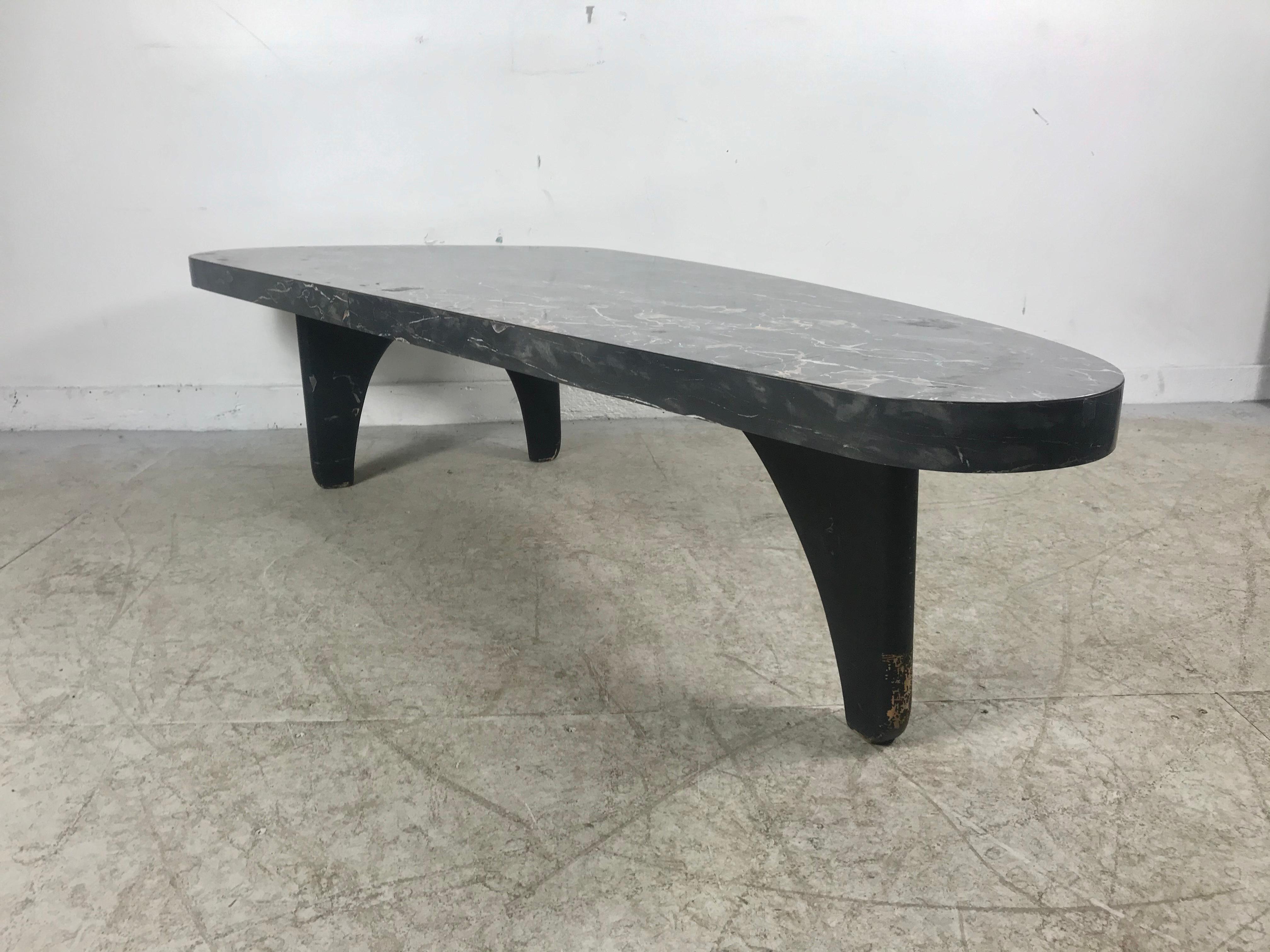 Classic Mid-Century Modern Asymmetric, kidney shape cocktail/ coffee table attributed to Adrian Pearsall, Very Noguchi Stunning laminate formica faux marble top, solid sculptural walnut base, lacquered black. Makes a statement, minor flaw to