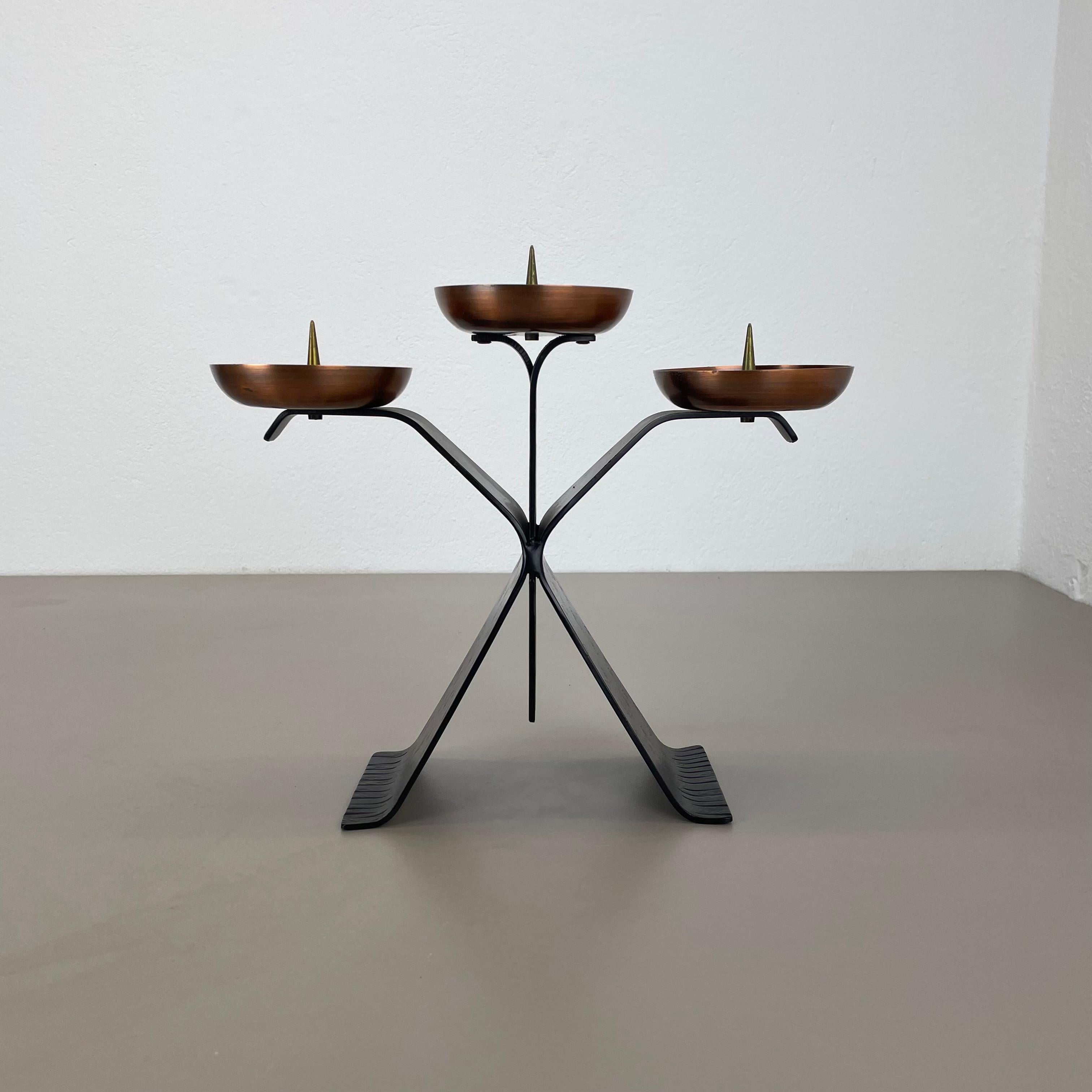 Article:

candleholder element


Origin:

Austria


Material:

copper and metal


Decade:

1970s



This original vintage candleholder, was designed and produced in the 1970s in Austria. It is made of solid metal in black lacquer tone and copper for