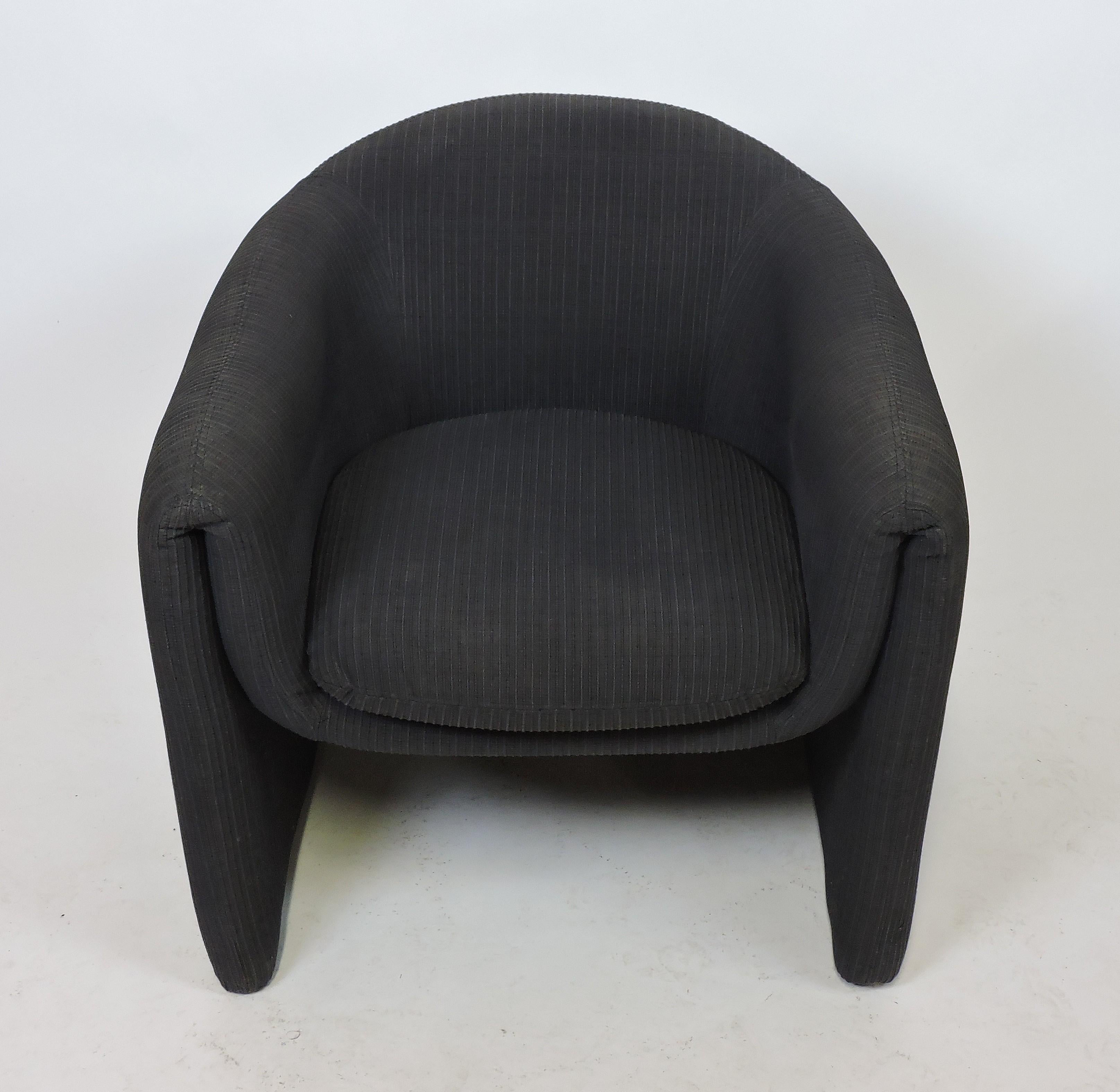 Curved and sculptural upholstered barrel back tub chair made by high quality furniture manufacturer, Preview. This chair has a loose seat cushion and is upholstered in a charcoal gray textured fabric. Labeled with the Preview label and the date of