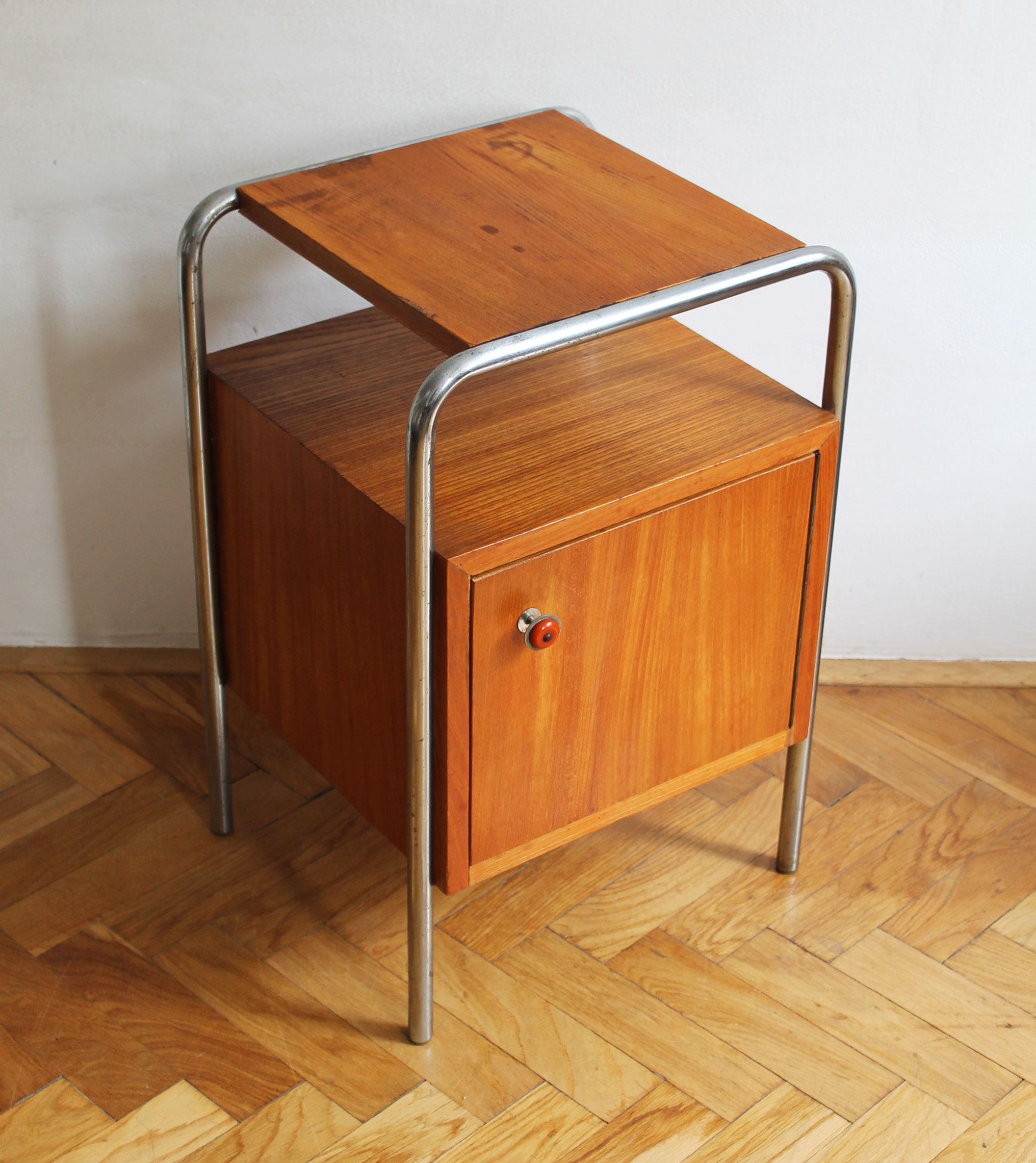 This is an Modernist Bedside table believed to be produced in former Czechoslovakia by Slezak Company. This particular design can be found in Slezak catalogues from the 1930’s as Model N6. 

The Slezak Company was one of the leading Czech furniture