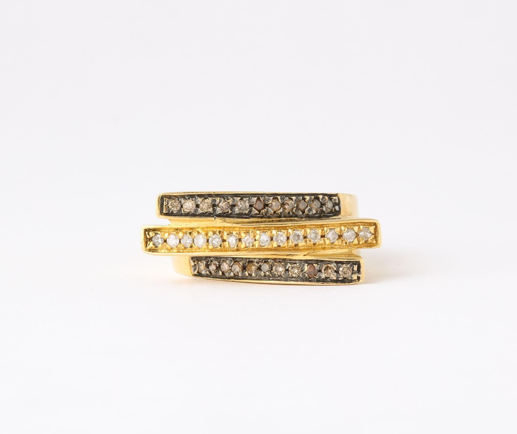 A wonderful Black and White Diamond and Gold Ring in a modernist setting.