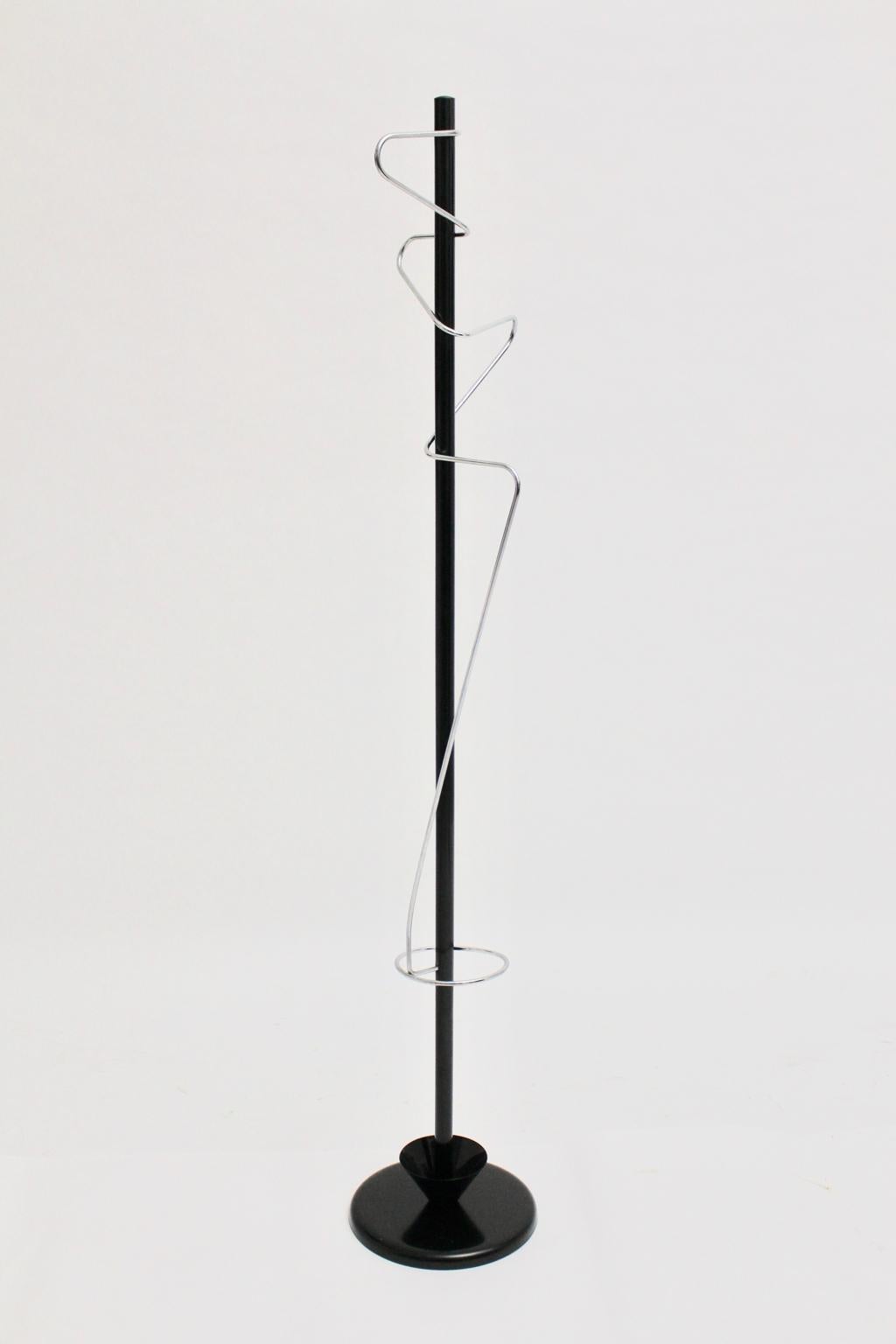 The coat stand was designed and made in the 1980s.
Also the coat rack features an umbrella stand.
It was made of black lacquered coated tube steel and chromed metal.
This vintage piece is in best condition.
approx. measures:
Diameter 37 cm
Height