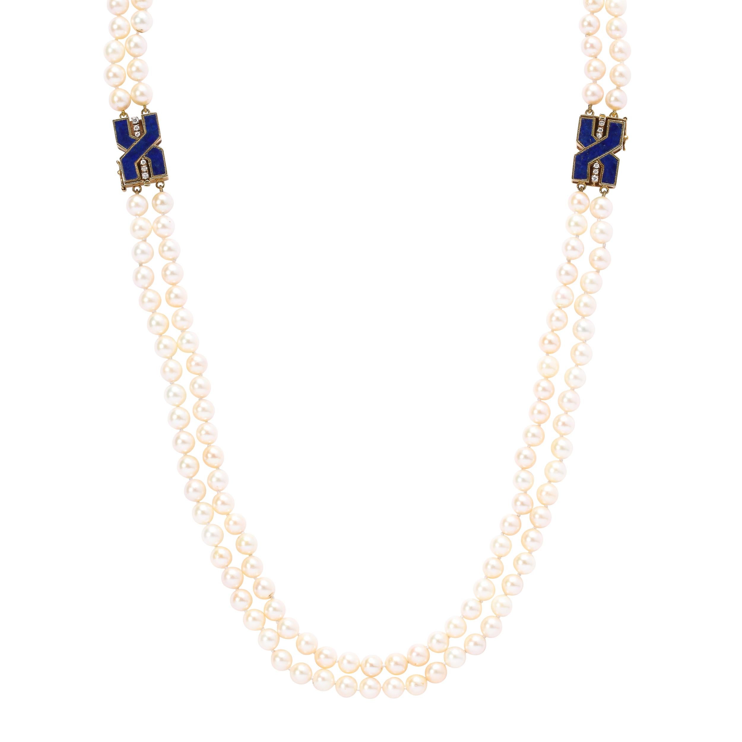 These very chic double strand pearls are a fine creamy rose luster and are approximately 7 mm and have 188 pearls joined by two 18k yellow gold clasps set with lapis and 6 round cut diamonds each. They feature a bold modernist geometric design very