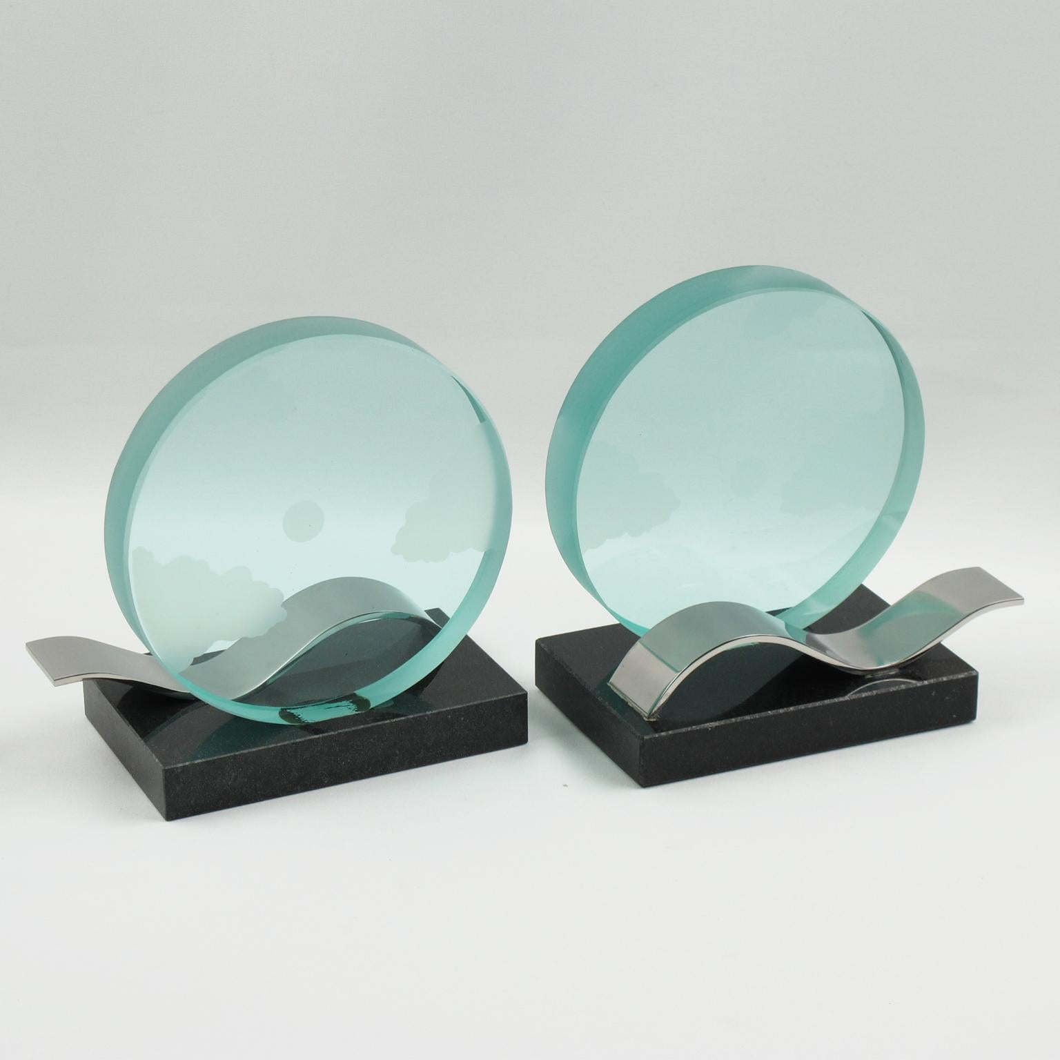 Elevate your interior with these striking, architecturally designed bookends—a true modernist masterpiece from circa 1980. The bold, round glass slab is delicately etched with clouds and dots, creating a mesmerizing interplay of light and texture.