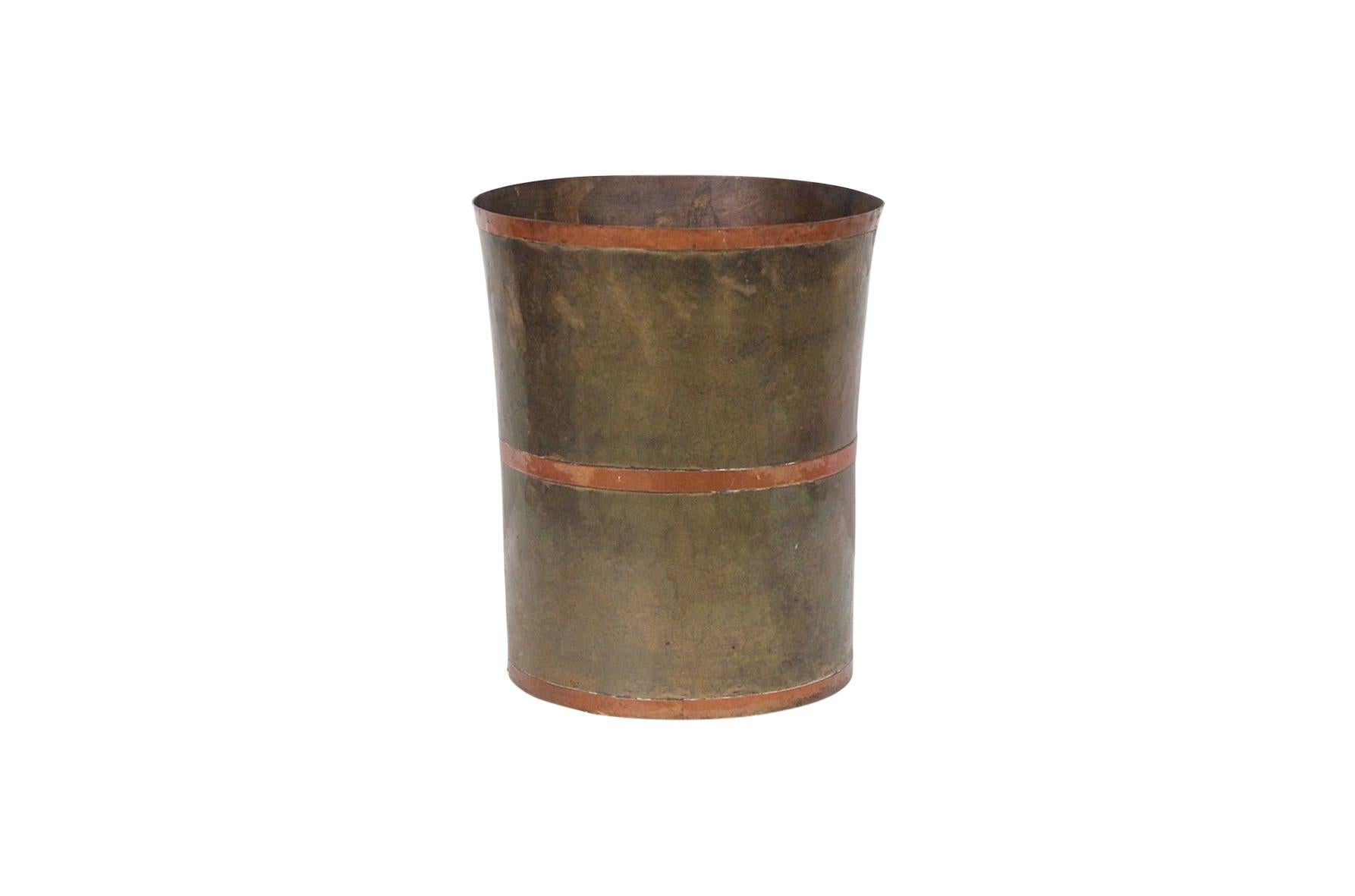 Modernist tapered brass wastebasket with riveted copper bands. Deep original patina.