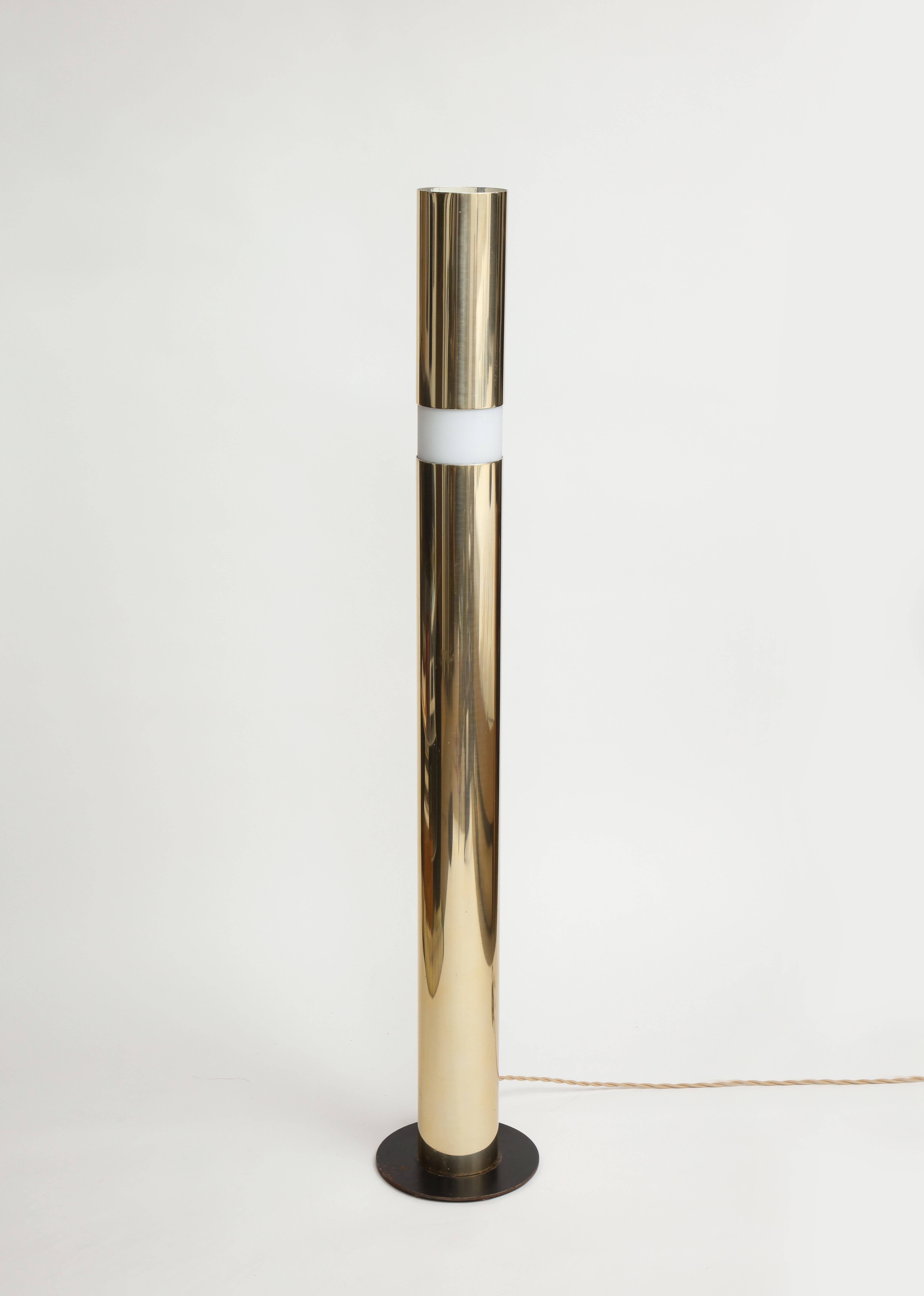Special piece. The top aspect of the cylinder form is an operable shade that moves up and down to modulate light by covering the etched diffuser. The base is patinated steel. The body of the fixture is aluminum plated in polished brass. The interior