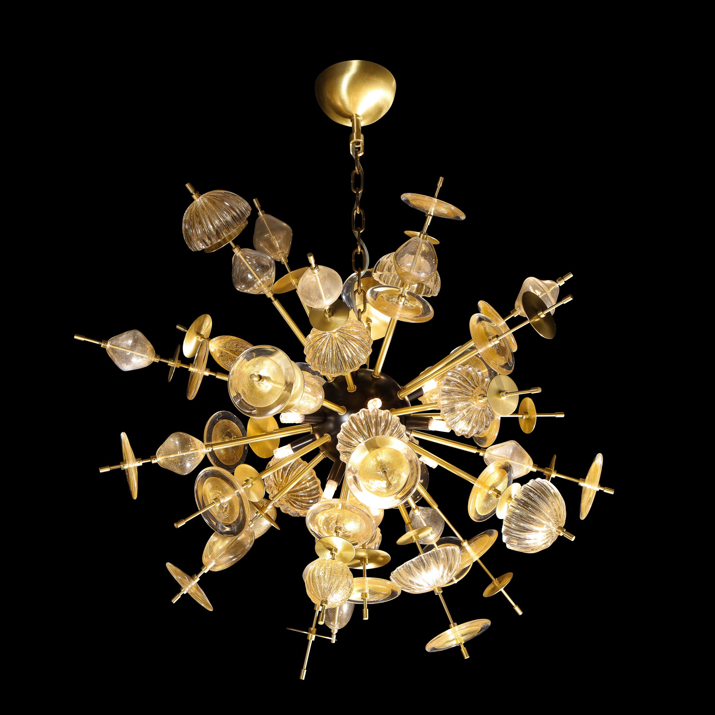 This stunning modernist sputnik was realized in Murano, Italy- the island off the coast of Venice renowned for centuries for its superlative glass production. It features a black enamel center with a wealth of brass spokes emanating outwards that