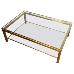 Mesa de centro modernista de latón con estantes de cristal ahumado de Guy Lefèvre para Jansen