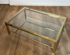 Modernist Brass Coffee Table with Smoked Glass Shelves by Guy Lefèvre for Jansen