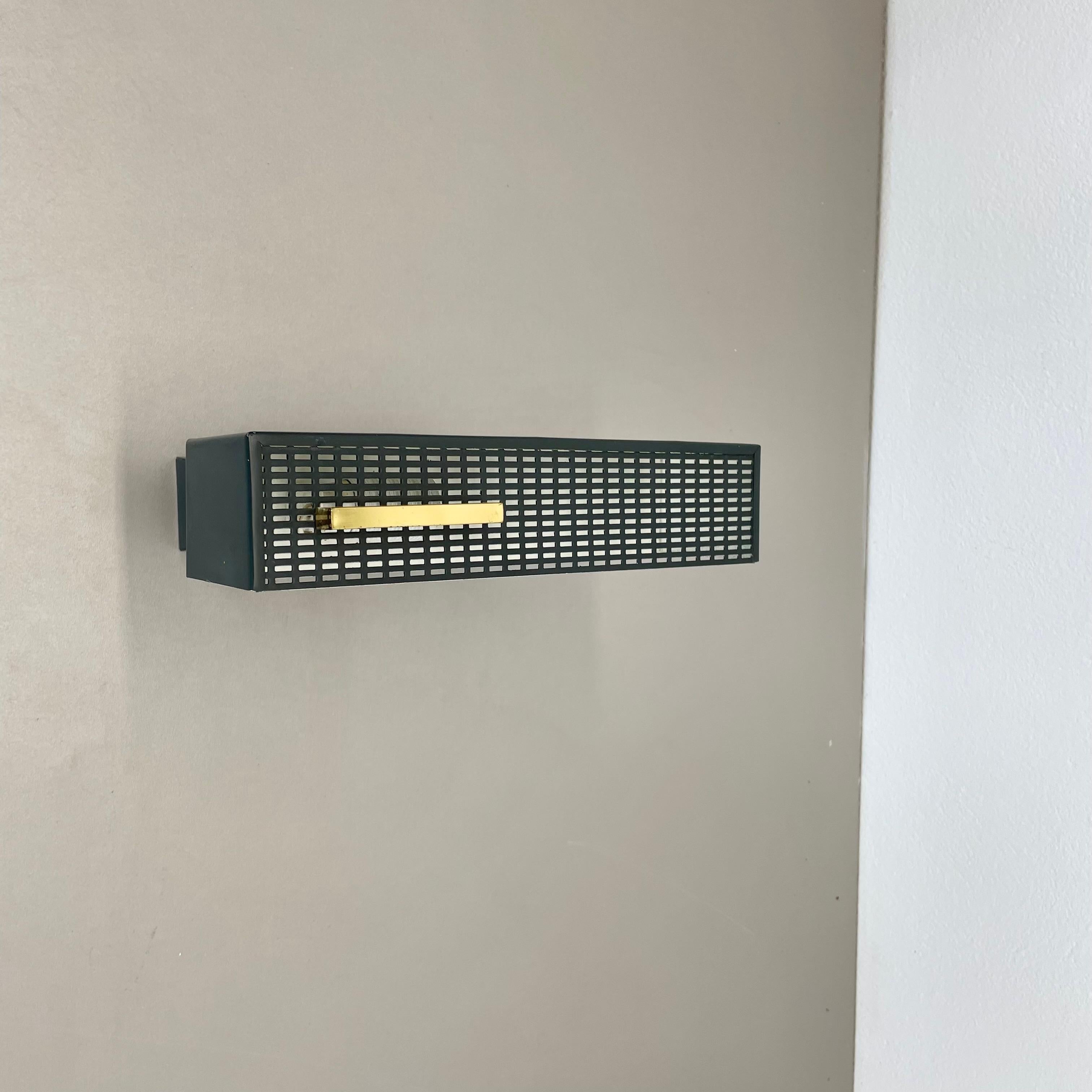 Article:

wall light


Origin:

Germany


Material:

Metal and brass


Age:

1950s




   

This original vintage wall light was designed in the 1950s and produced in Germany. it is in its absolute authentic complete vintage condition. the light is