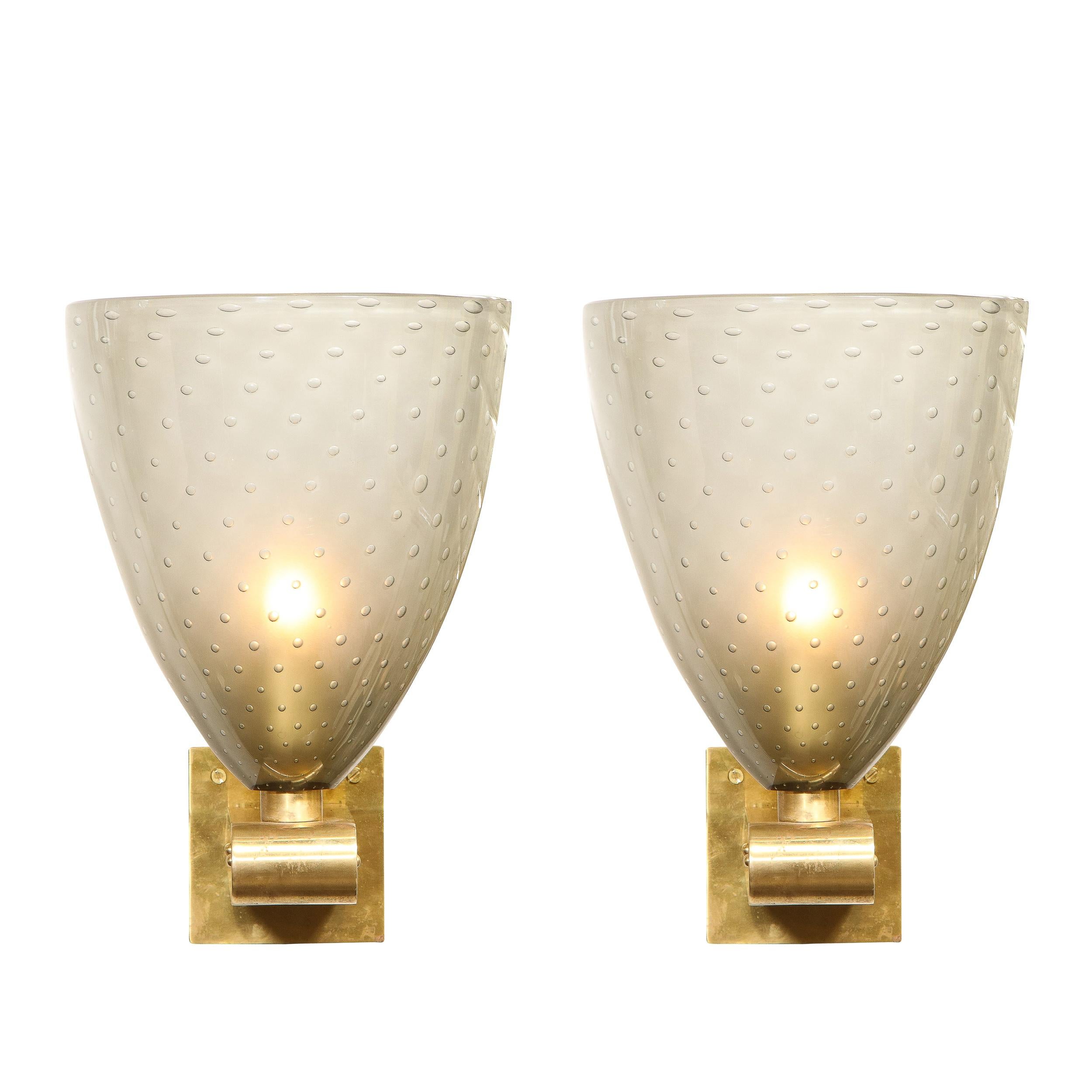 This gorgeous pair of sconces were hand blown in Murano, Italy- the islands off the coast of Venice renowned for centuries for their superlative glass production. They are composed of billowing semi-translucent smoked glass shades replete with an