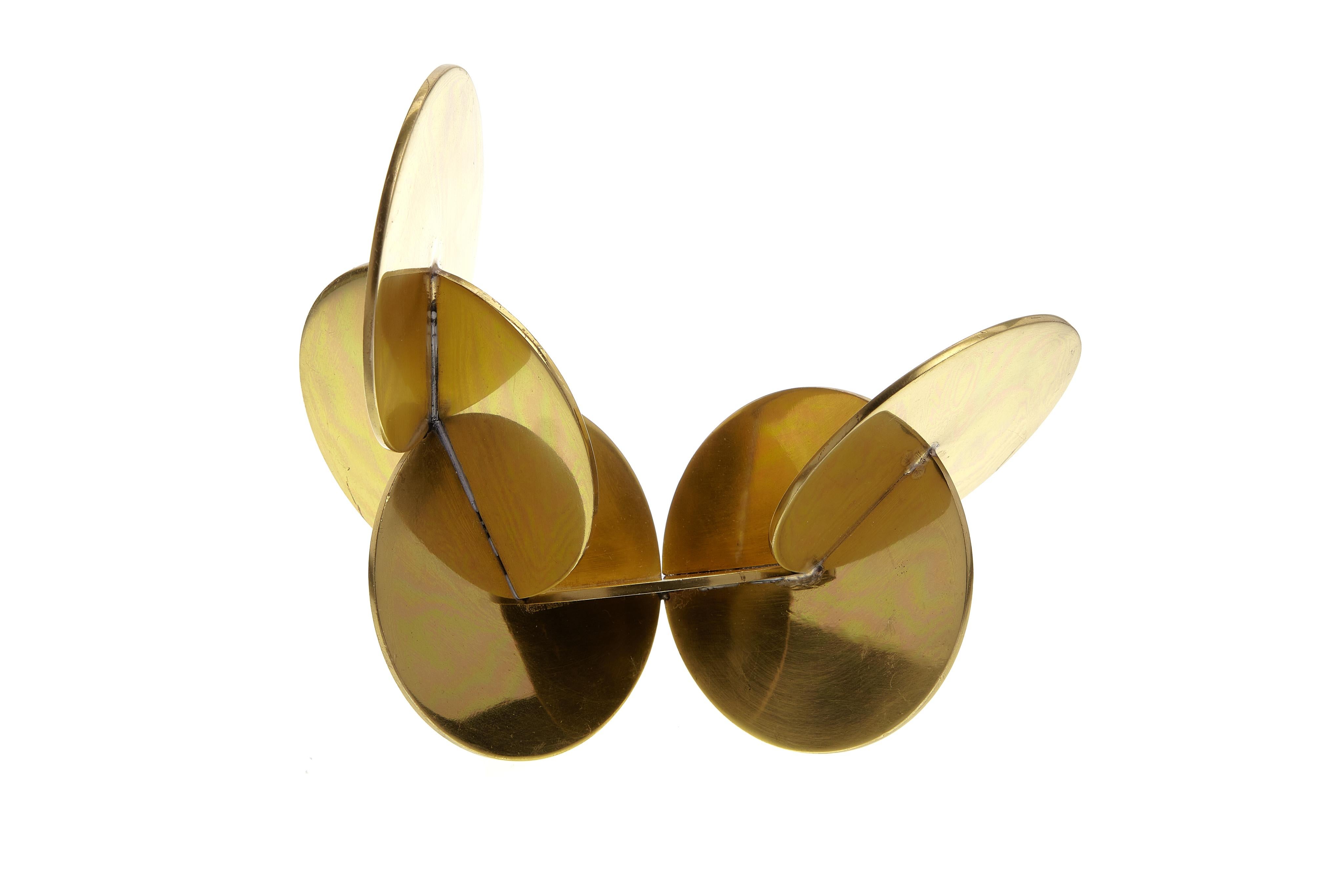 A fine example of modernist sculpture, featuring interlocking brass discs.