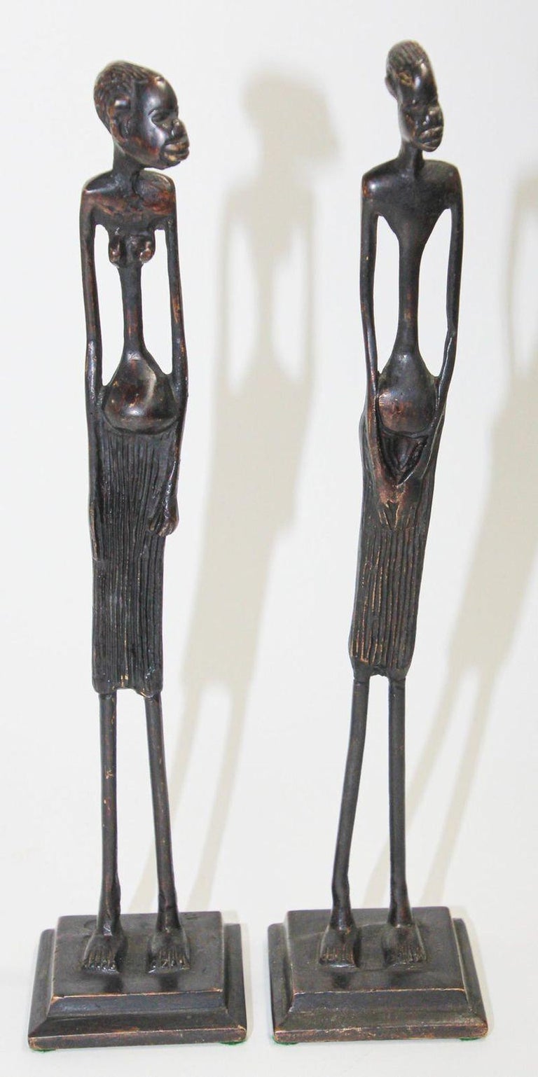 Modernist bronze African abstract statues, whimsical figures of a couple.
Unusual vintage brutalist African bronze sculptures.
Hand-hammered cast bronze stylized tribal figures sculpture with elongated spindle like legs, a man and a lady.
Etruscan
