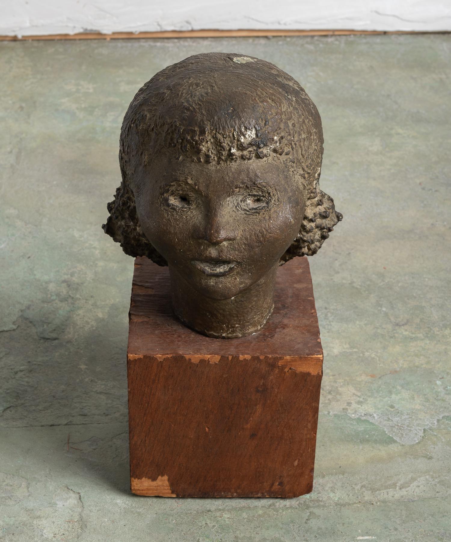 Modernist bronze female bust, circa 1920

Expressionistic and quaint bust, which sits atop an original wood base.

This piece ships from Providence, Rhode Island.