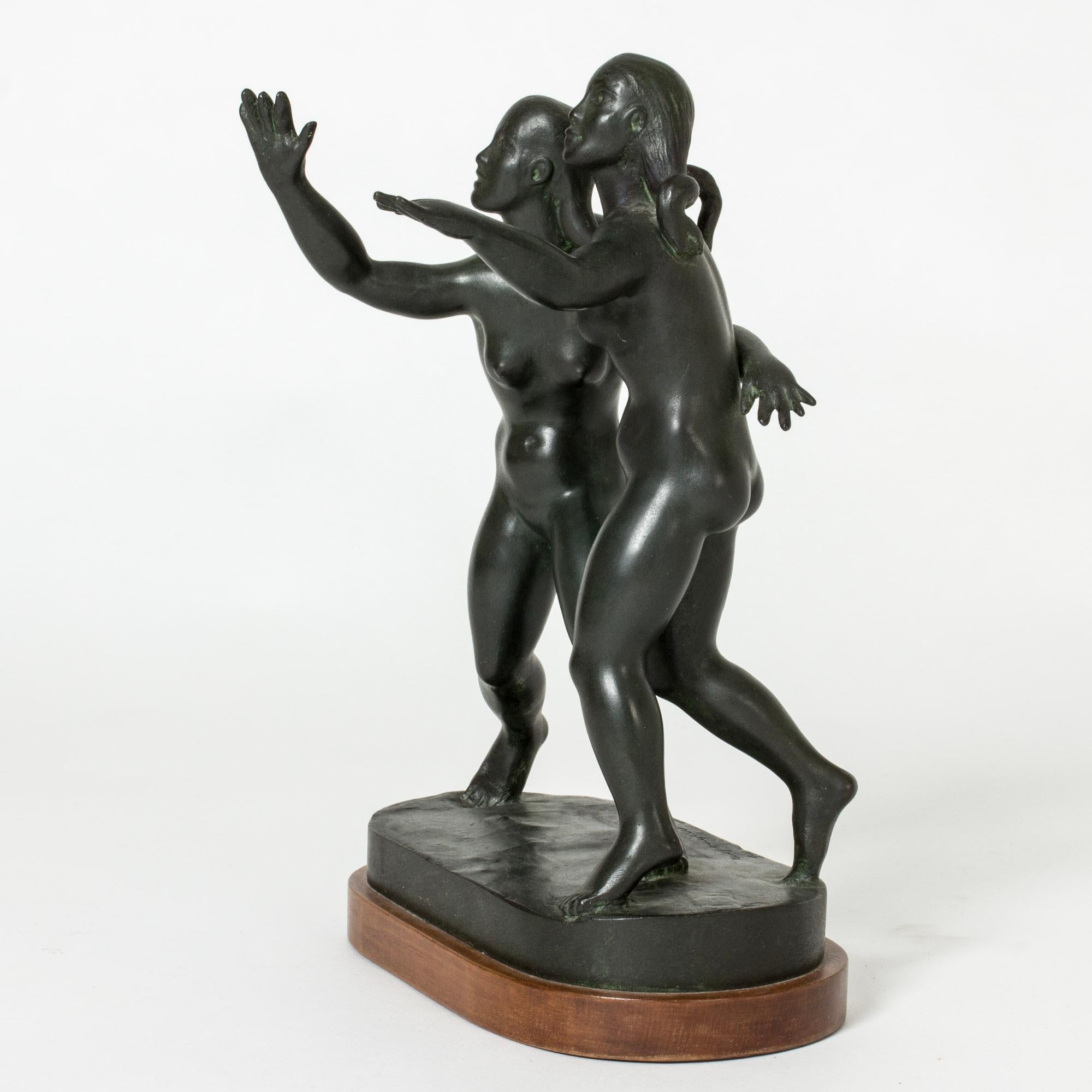 Beautiful bronze figurine by Nils Fougstedt, in the form of two young women. The women are reaching out their arms and have their faces turned upwards. Lovely attention to detail, vivacious expression.
