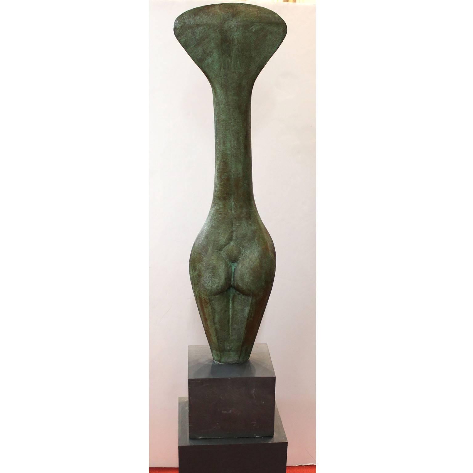 A large Mid-Century Modernist style patinated bronze sculpture of a stylized tall female torso. Artist unknown; unsigned. Very good original condition.
