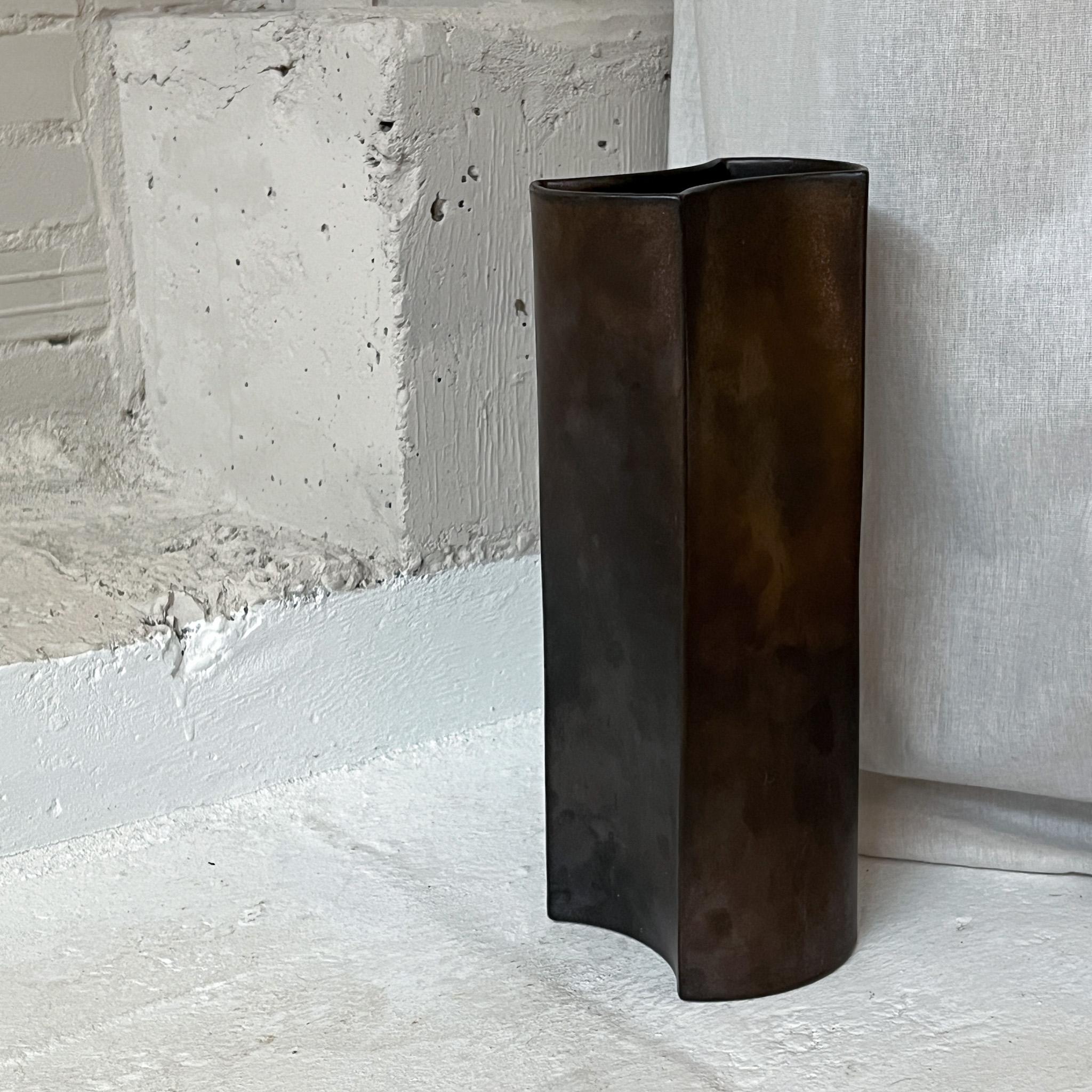 Stunning and rare vase, by Jan van der Vaart. Jan van der Vaart is one of the most influential Dutch ceramists of the 20th century, known as founder of the abstract-geometric ceramics in the Netherlands.This vase with its sleek torsion body a great