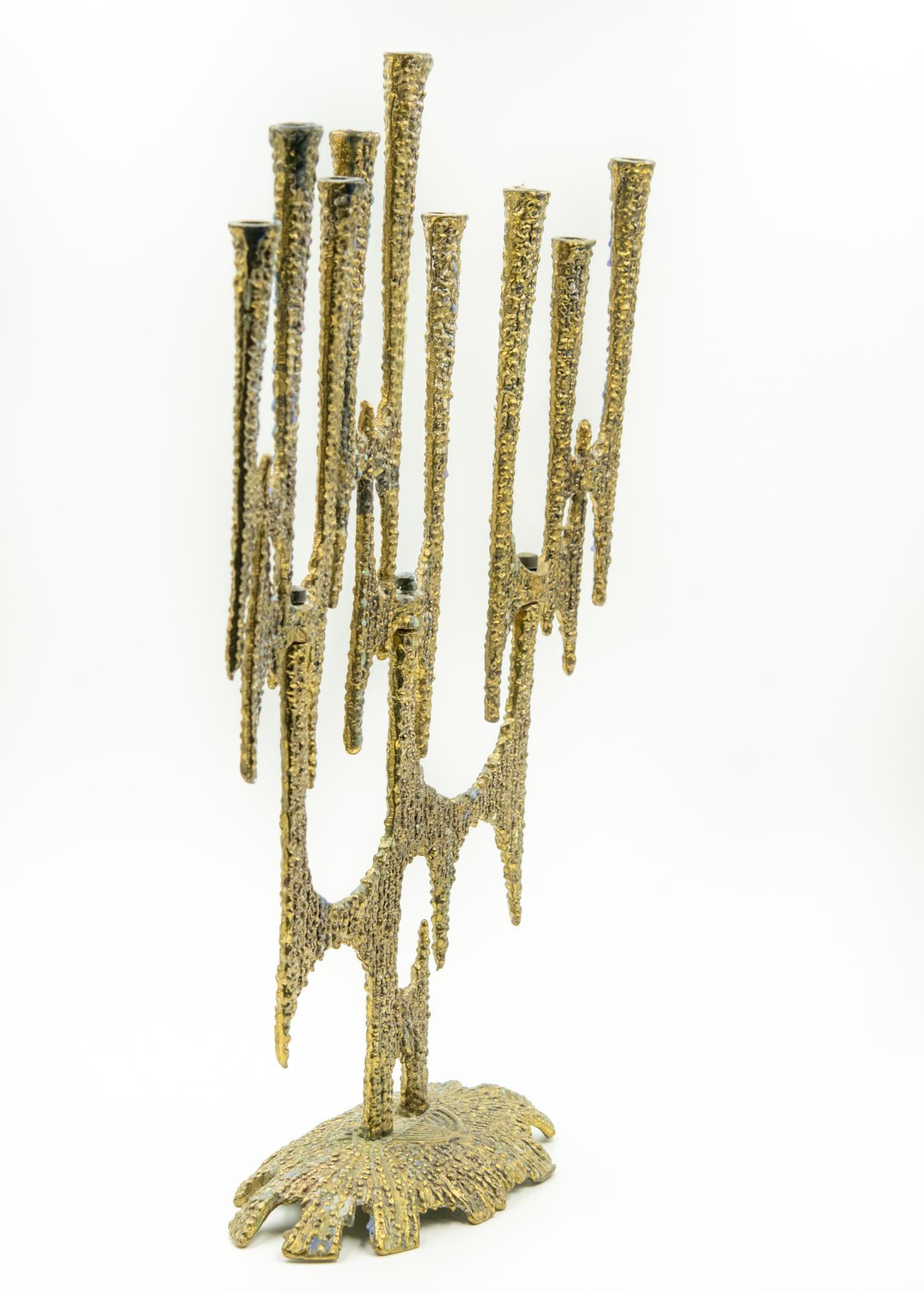 Tarnish wax
3 turnable sections with 3 candles each
Marked made in Israel
Measures: 13.5” tall by 9” long by 3.25” deep.