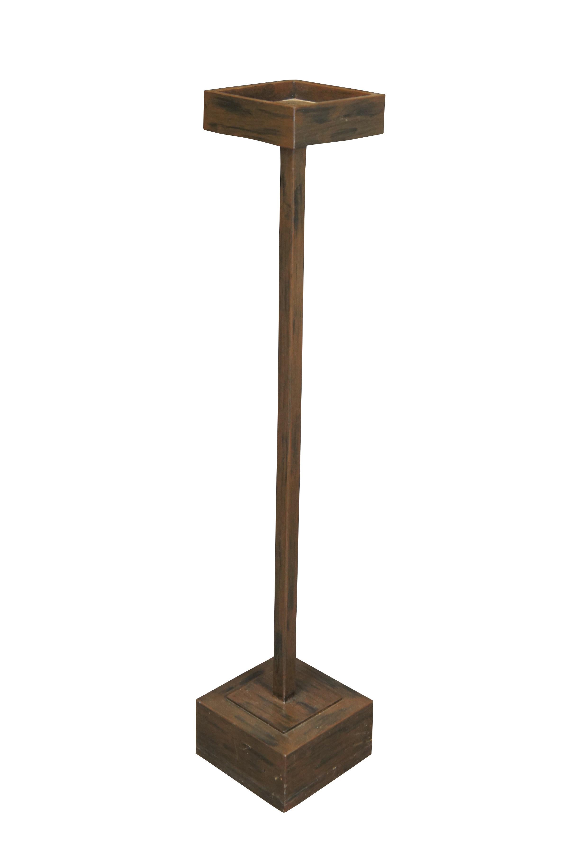 Pair of modern brutalist heavy metal candle / plant stands featuring square bases and tops with a distressed finish.

Dimensions:
7.5