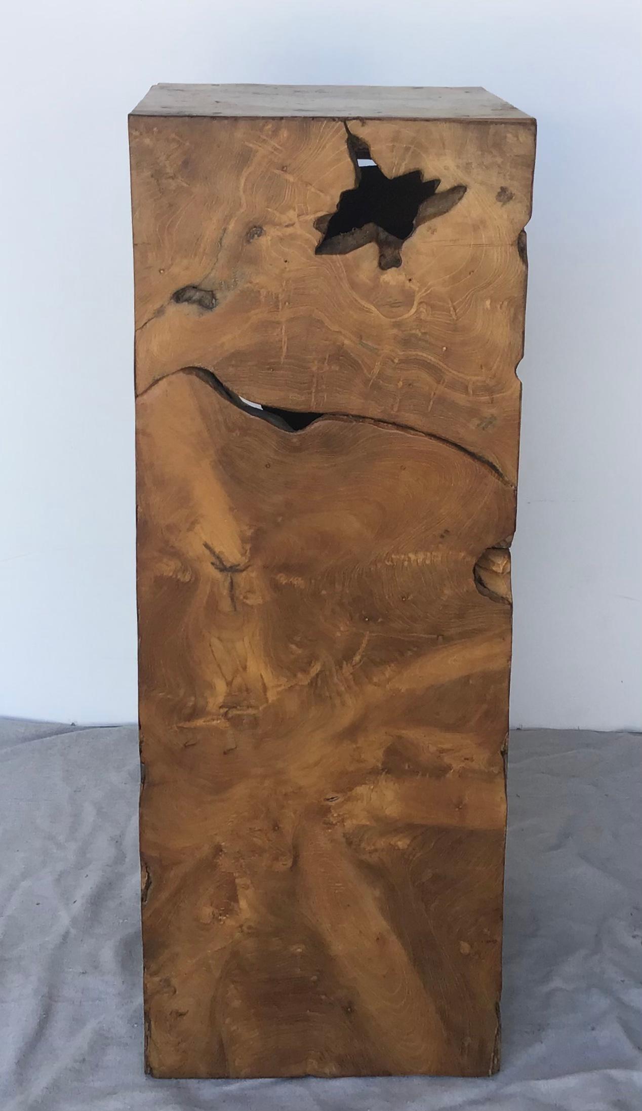 Nice burled wood column that can be used as a table or to display a sculpture. This rustic yet chic pedestal has been artisan created with a live-edge burl wood, with wonderful knobby bits, voids, and organic movement to it.  This burl wood pedestal