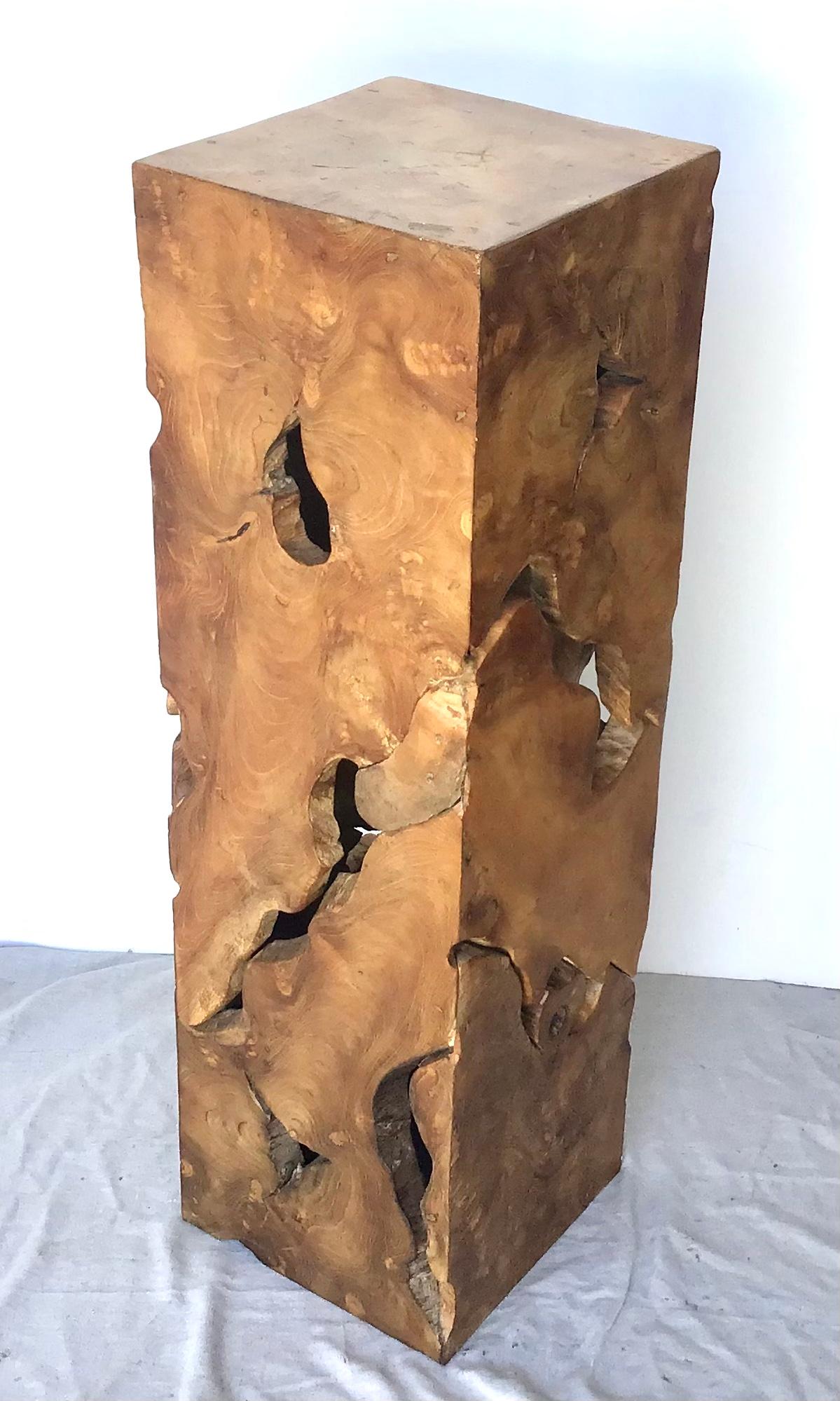 Nice burled wood column that can be used as a table or to display a sculpture. This rustic yet chic pedestal has been artisan created with a live-edge burl wood, with wonderful knobby bits, voids, and organic movement to it. This burl wood pedestal