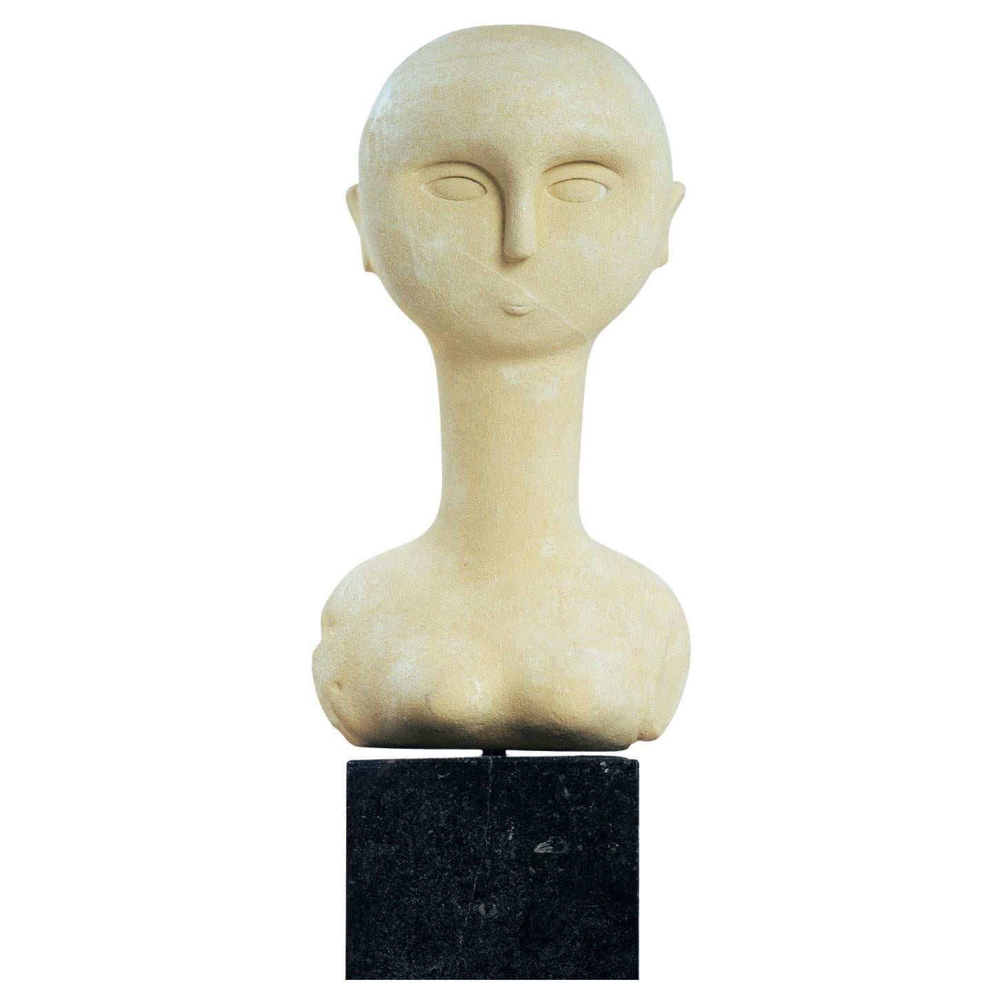 modernist bust sculture of a woman in sandstone