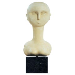 modernist bust sculture of a woman in sandstone