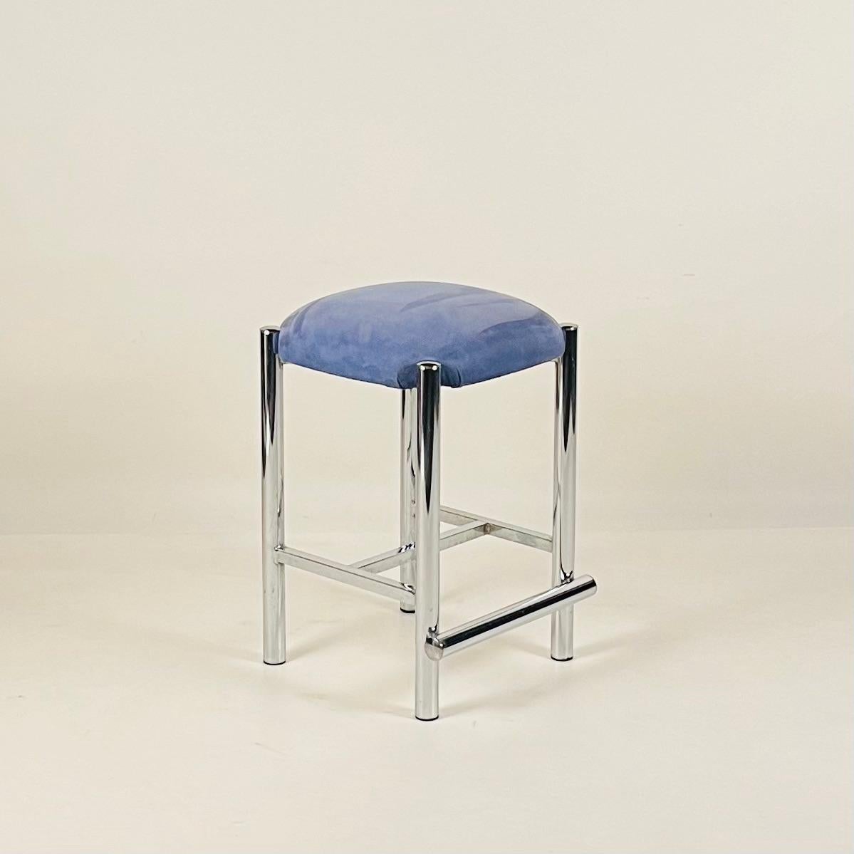 Set of 3 minimalist mid-century counter stools with chrome legs and suede seats. 

Looking for more? We have another set of 4 available to make a set of 7 stools. Please inquire. 

These could easily be reupholstered in COM. 