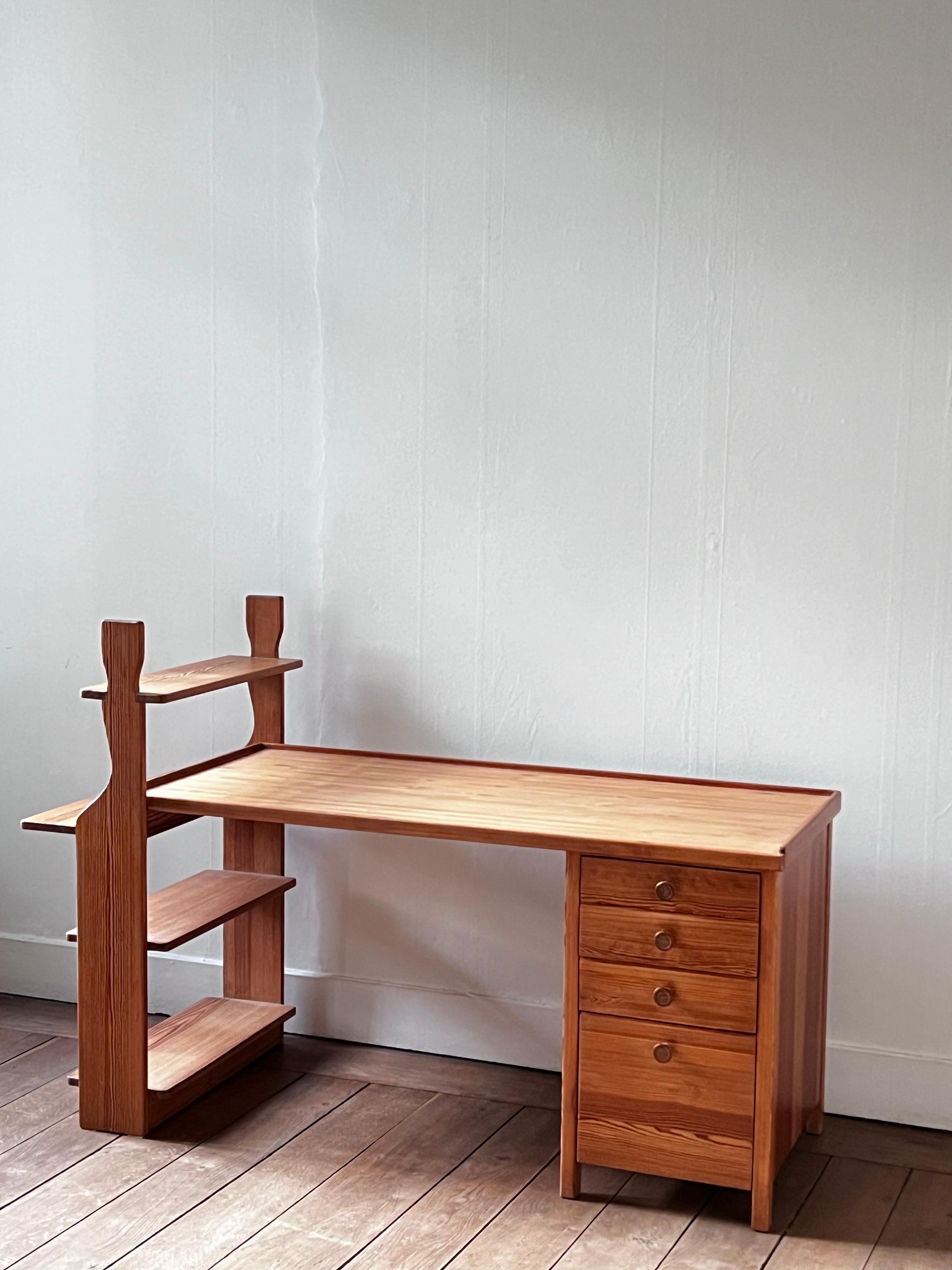 This is a  unusual desk made out of pine. Produced in Sweden around the 1940s. It is a so unique in the shape, the base is very unusual with the shelf as a feet. It will brighten any projects. Everything was restored but it still shows tiny traces