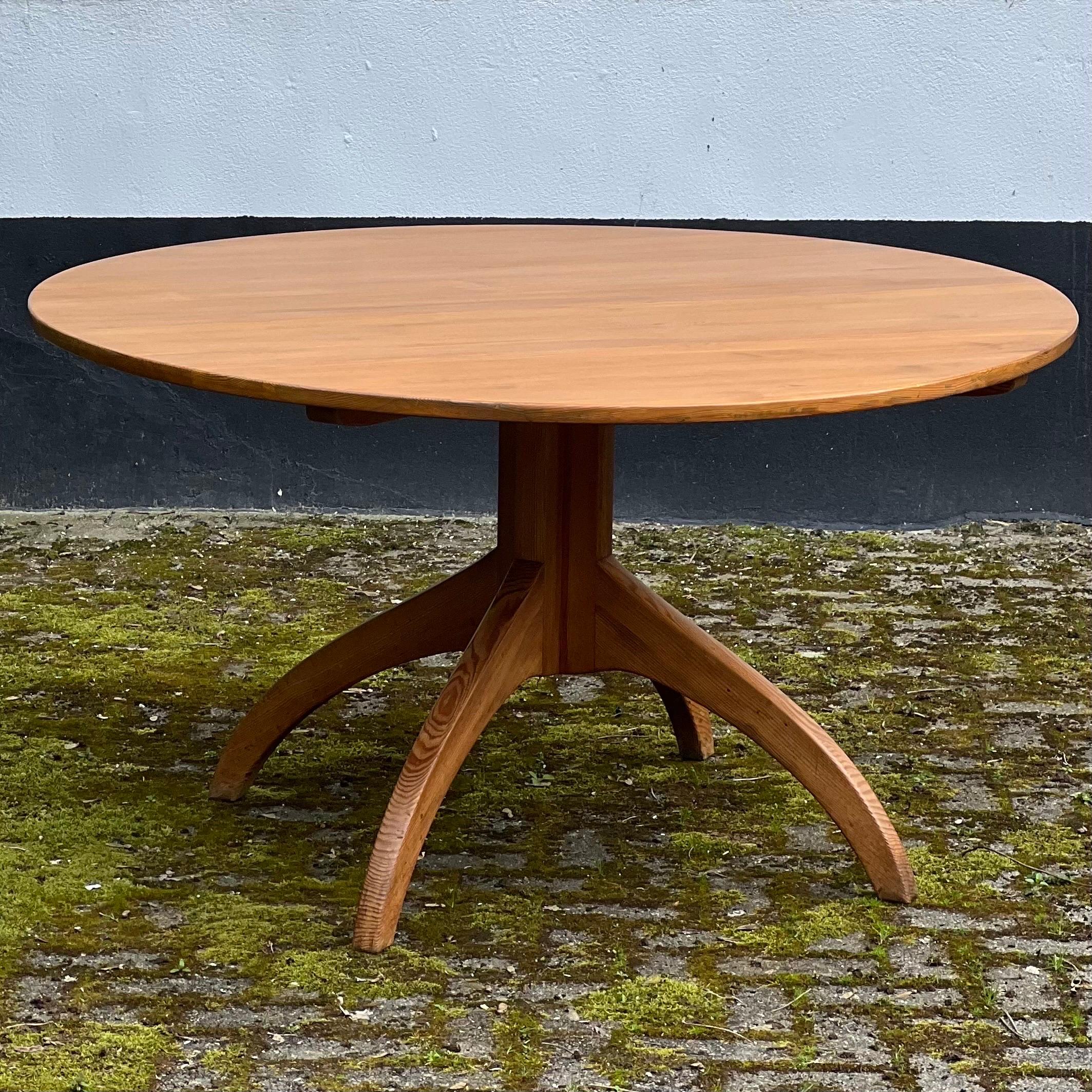 This is a large and unusual dining table made out of pine. Produced in Sweden around the 1940s. It is a so unique in the shape, the base is very unusual. It will brighten any projects. Nice patina on the base. We just cleaned it and waxed it. The