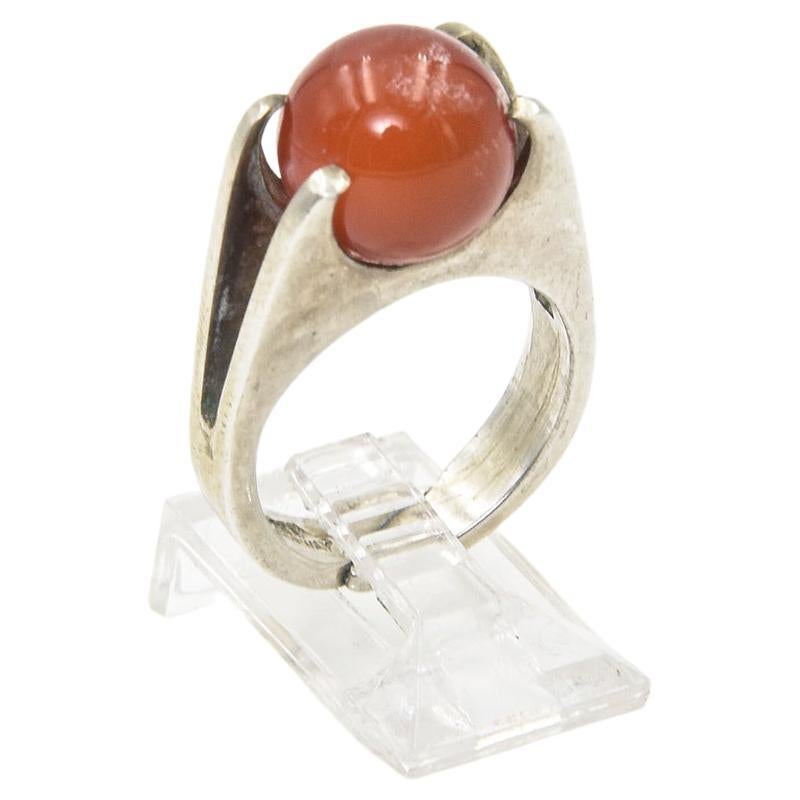 David Andersen Modernist sterling silver ring with carnelian ball that you can spin inside the mount.  Marked D-A 925S sterling Norway.
US size 6.25