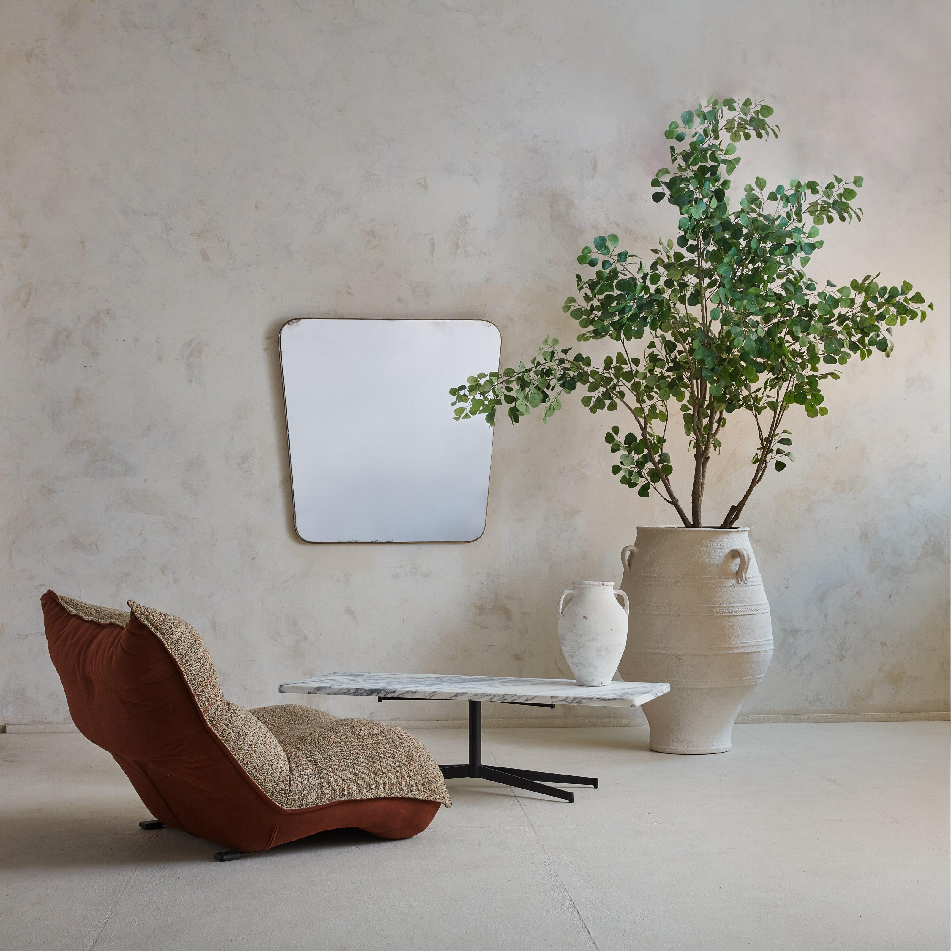 A 1950s French Modernist coffee table sourced from an architect’s home in the South of France. The clean, minimalist design features a rectangular top crafted from white Carrara marble with gorgeous gray veining and a honed finish. An industrial,