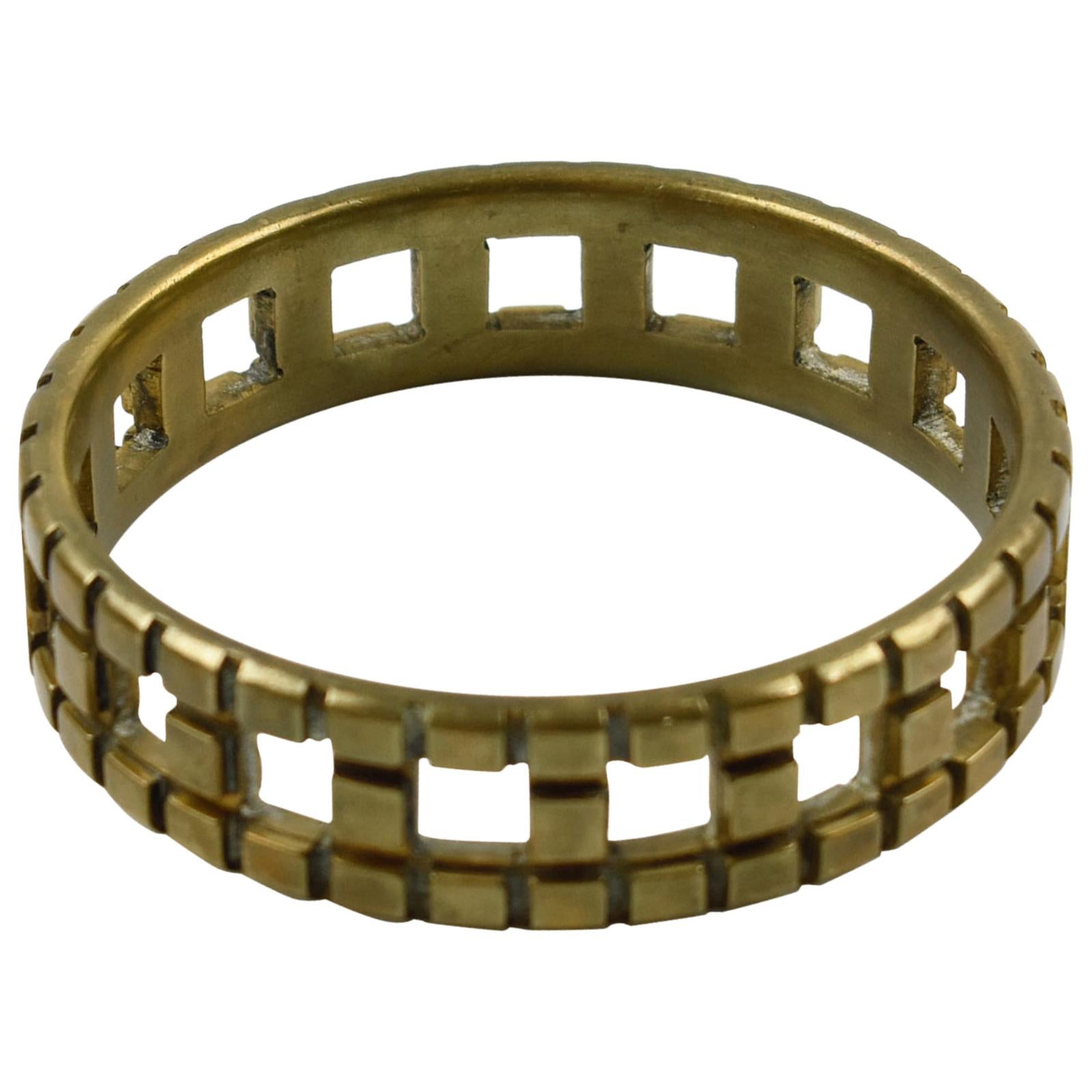 Stunning French artisan studio modernist bronze bracelet. Chunky bangle shape with a geometric see-thru design. There is no visible maker's mark.
Measurements: Inside across is 2.50 in. diameter (6.4 cm) - Width is 0.69 in. (1.8 cm).

Be sure to
