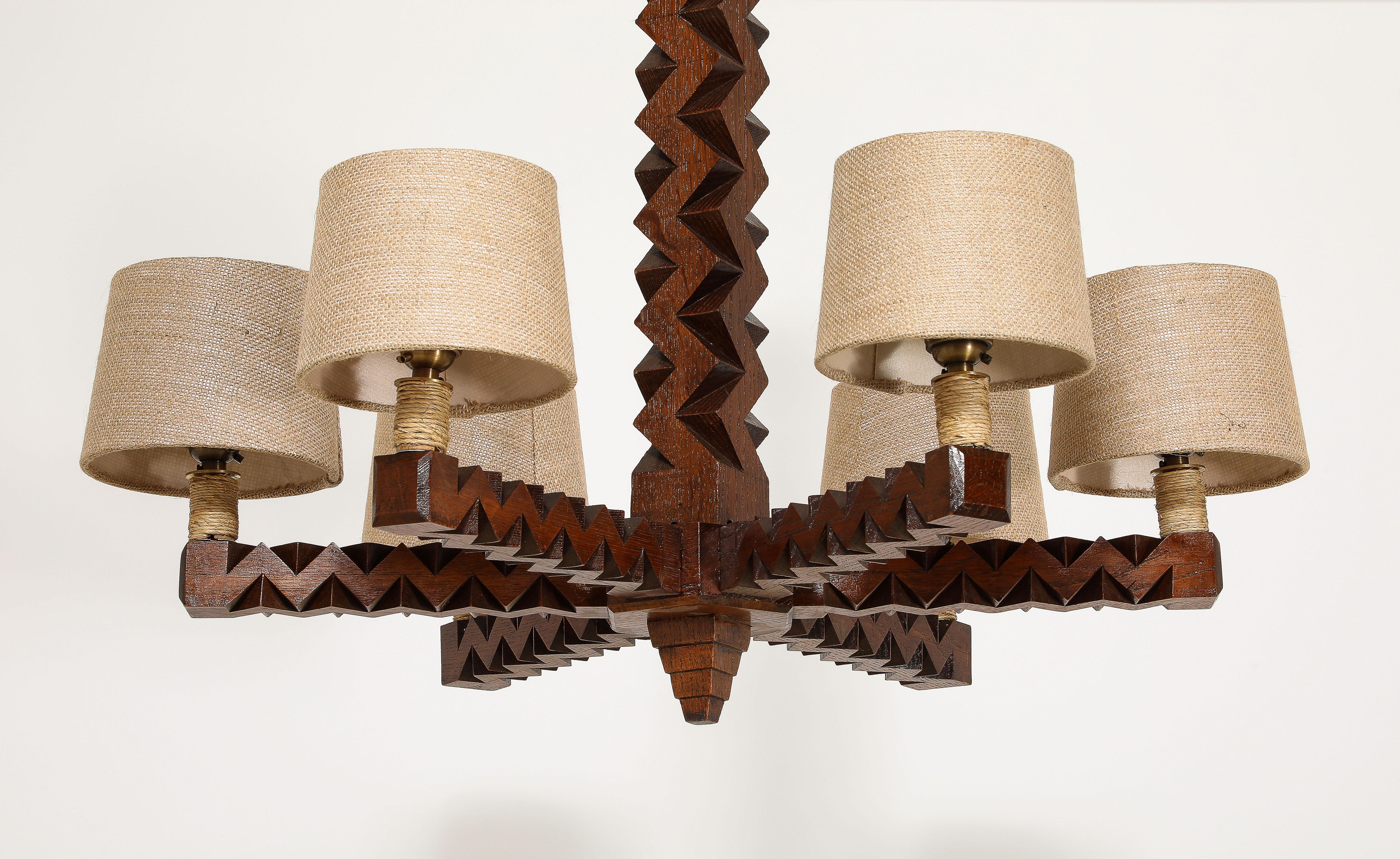 Large Oak carved pendant with six lights, the body carved in a geometric pattern, original matching canopy and chain.
