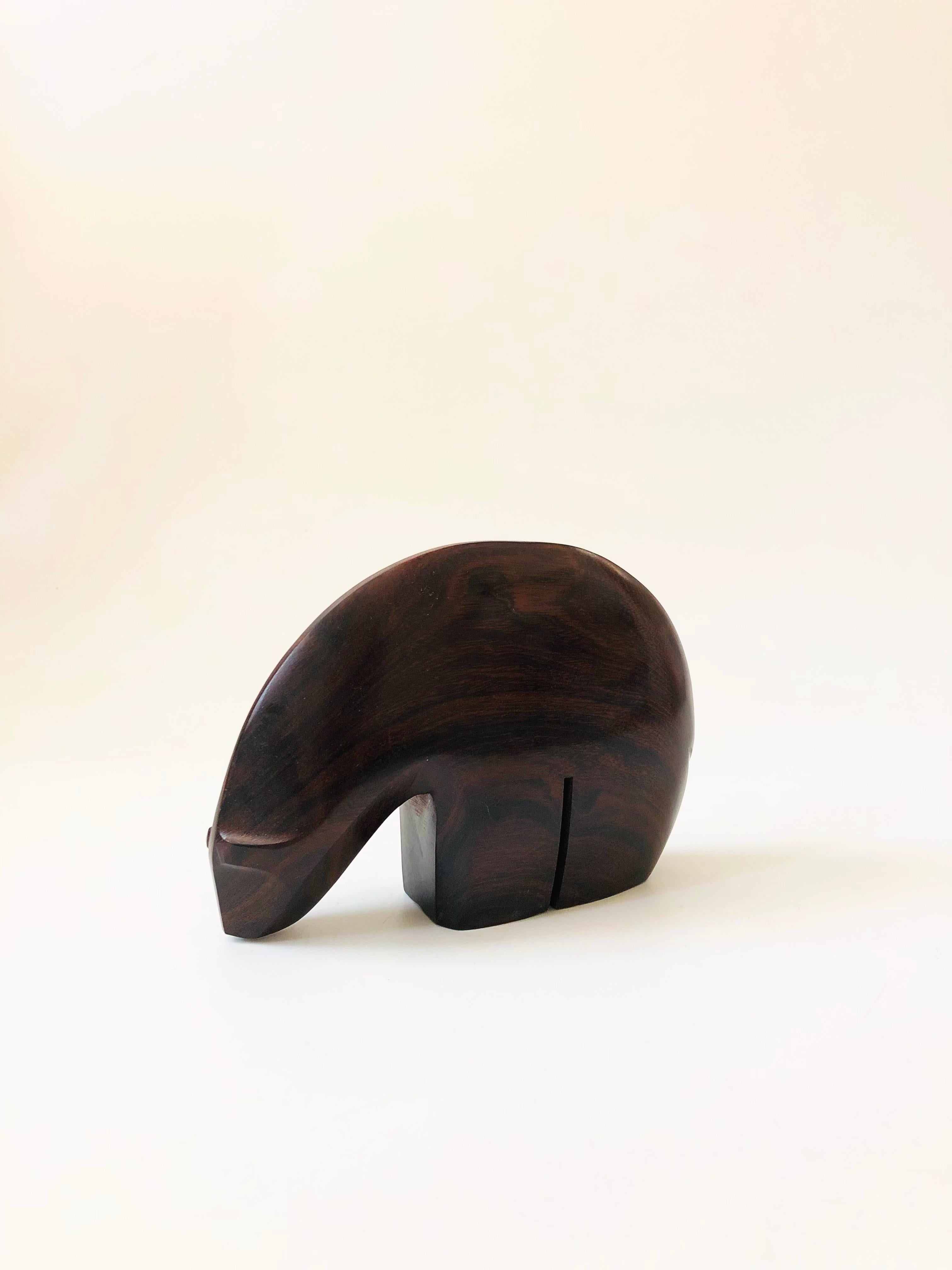 A vintage carved ironwood polar bear. Great simplified modernist form with a lovely dark natural grain and smooth finish to the wood.

