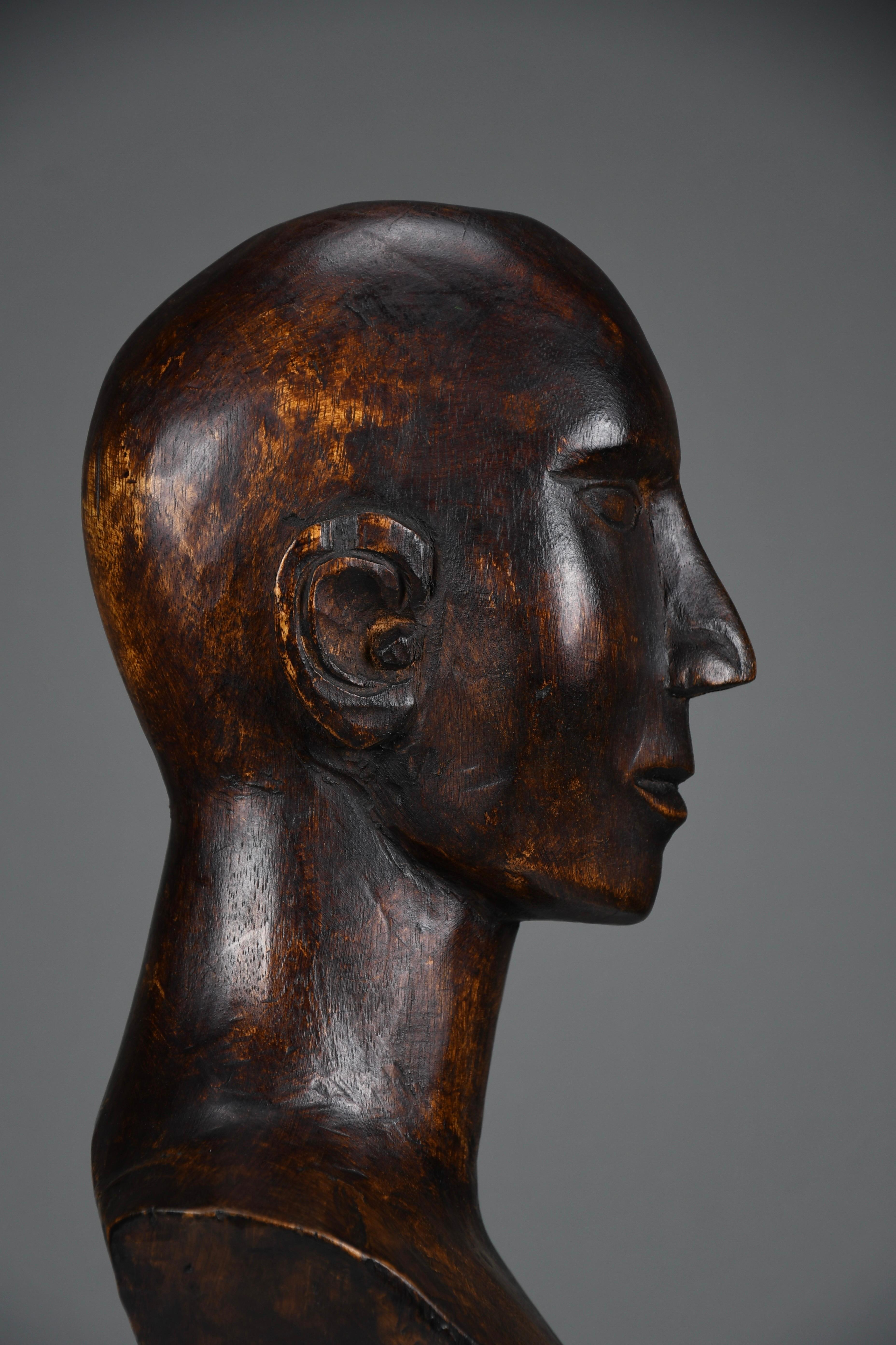 Modernist Carved Wooden Bust, ca. Mid-20th Century

This striking hand-carved wooden bust exemplifies the timeless elegance of modernist sculpture. With its elongated proportions, stylized facial features, and smooth, tactile surface, the piece