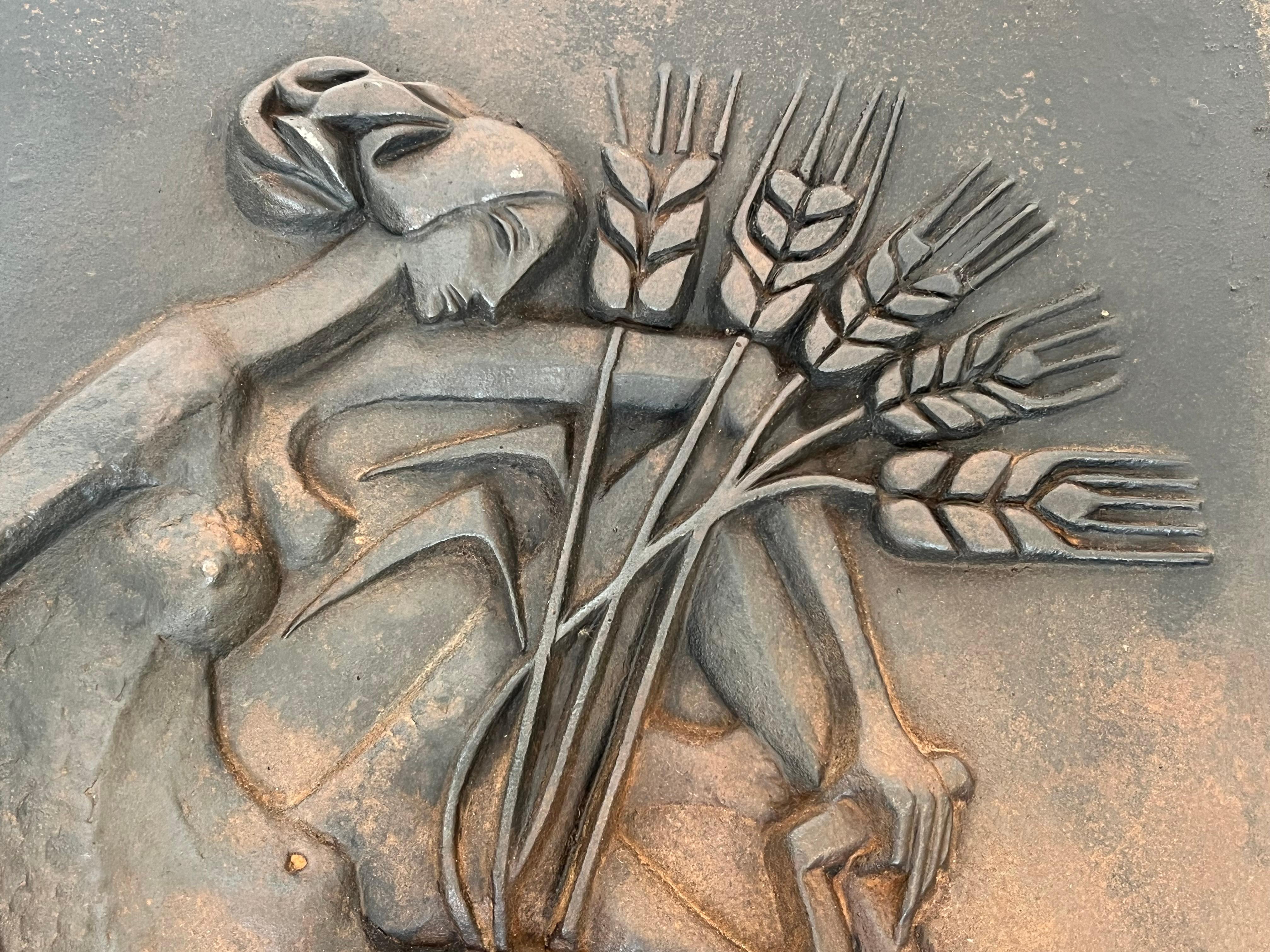 Mid-20th Century Modernist Cast Iron Fireback Representing a Woman with a Scythe & Ears of Wheat For Sale