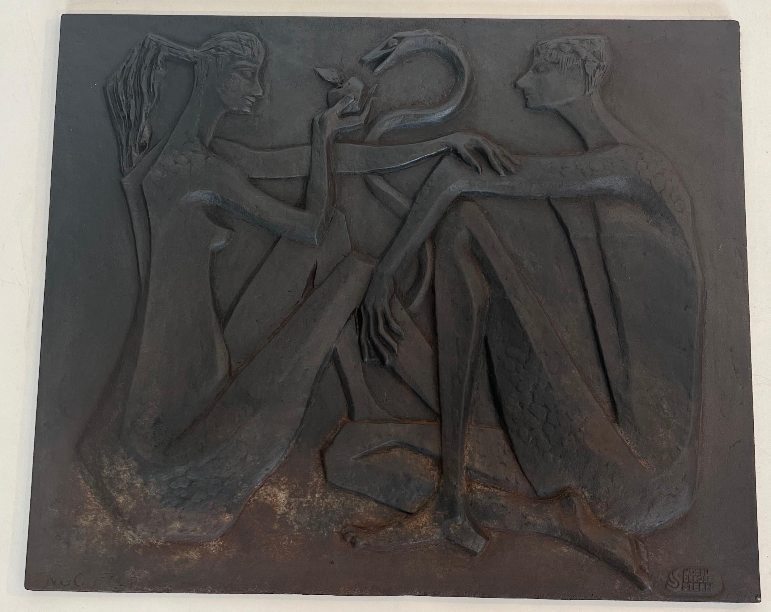 This beautiful and rare modernist fireback  is made of cast iron. It represents Adam and Eve, the apple and the snake. This is a French work signed and edited by Stern. Circa 1970.