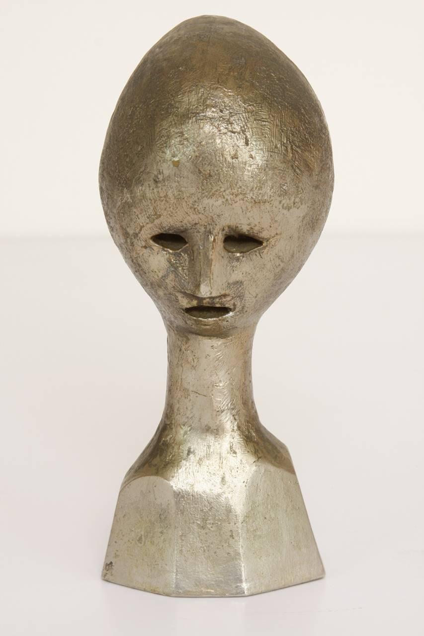 Unusual Mid-Century Modern lost wax casting of an abstract figurative head bust. Features a bronze finish made in the manner or style of Henry Moore. Signed 