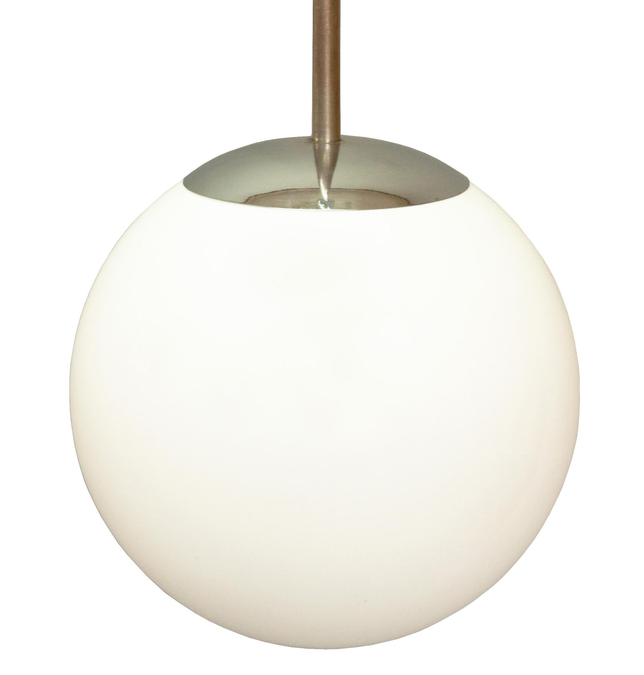 A great example of a modernist ceiling mounted pendant designed in Czechoslovakia in the 1930s. The simplicity of its form makes this piece timeless.