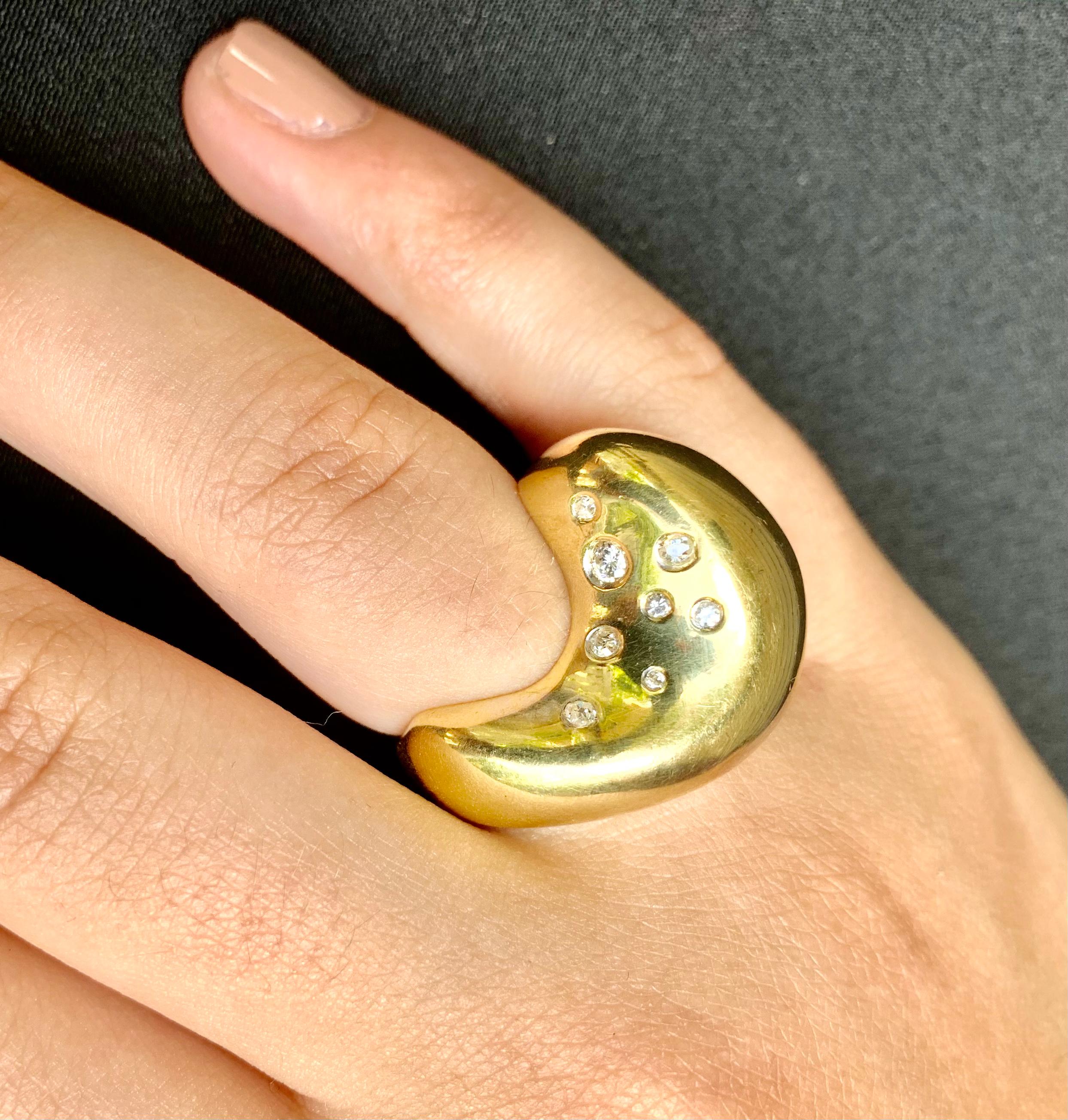 
Large, unusual, artistic 18K yellow gold and diamond Celestial Constellation statement ring. 
This beautiful ring depicts a stylized moon set with a diamond star on one side and a constellation of eight diamond stars on the other. Celestial jewelry