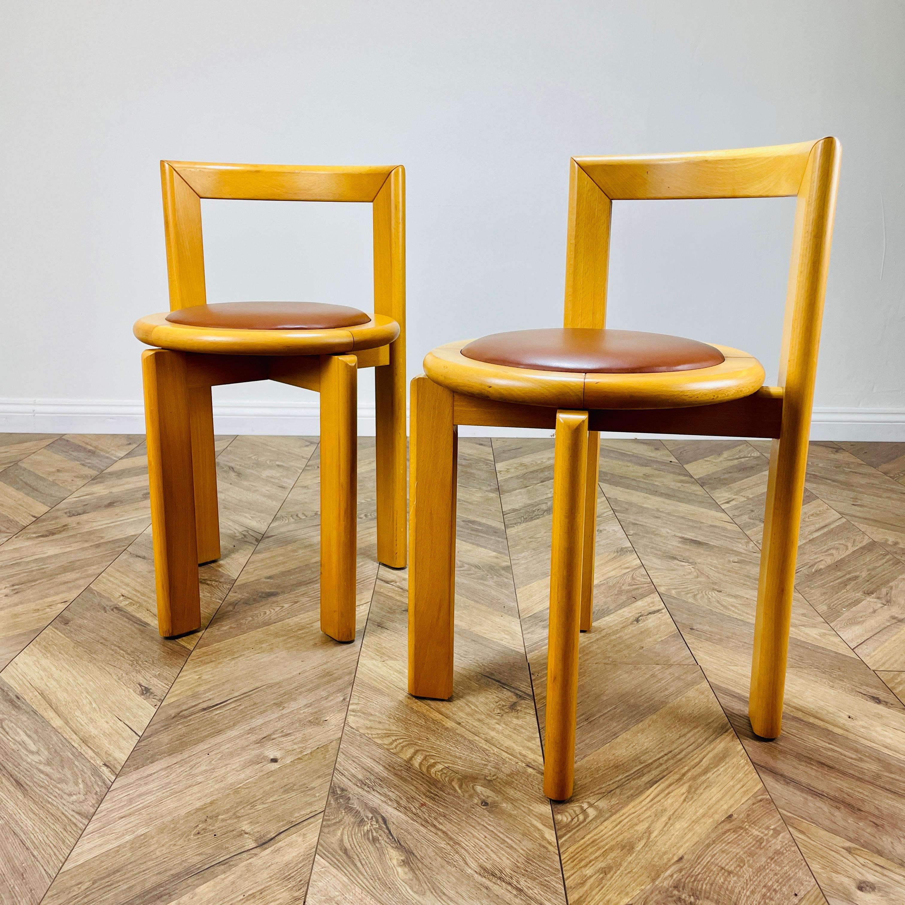 A Pair of Mid Century, Modernist Chairs Made in Sweden by Glimåkra, very much in the style of Bruno Rey.

Boasting clean lines and in good vintage condition, the blond wood and vinyl seats, which provide a lovely contrast to these comfortable