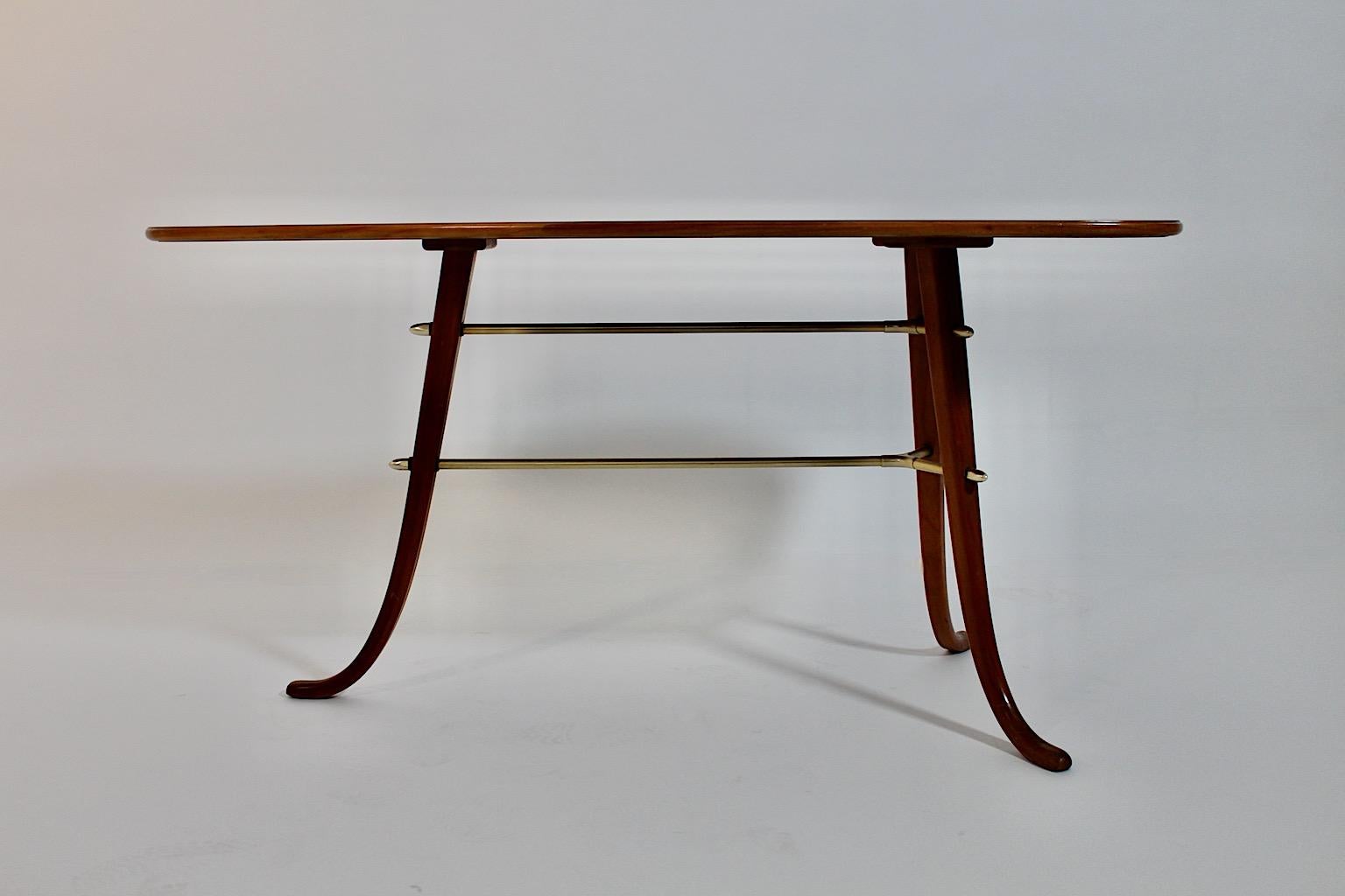 Modernist Mid-Century Modern vintage side table or coffee table from cherry wood and brass attributed to Josef Frank for Svenskt Tenn 1950s Sweden.
An absolutely stunning coffee table or side table from beautiful cherry wood and brass details in