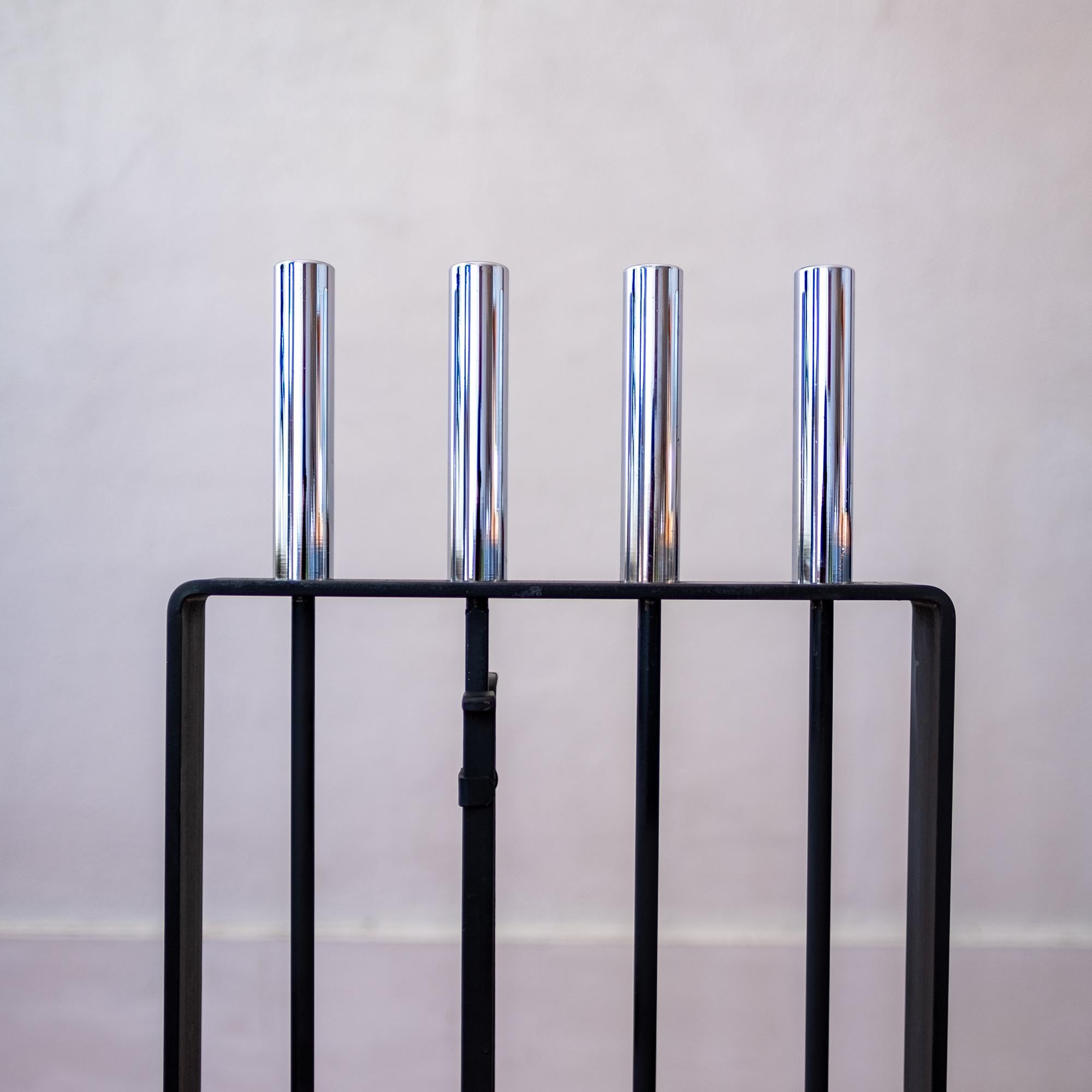 A set of modernist iron fireplace tools with chrome handles. The set includes a shovel, broom, poker and log grabber, 1960s.