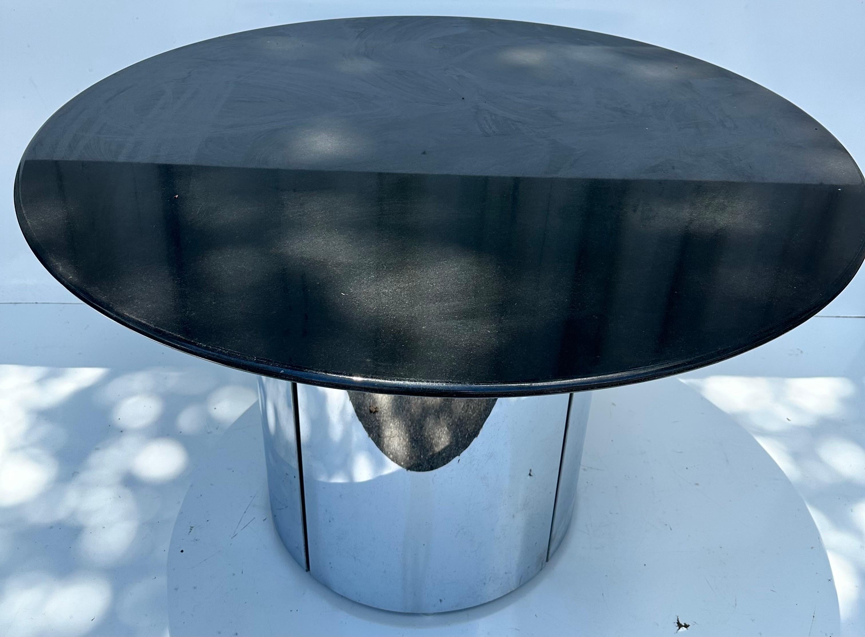 Modernist chrome and marble top drum table .
Heavy and sturdy,
Diameter of the drum : 24 inches.