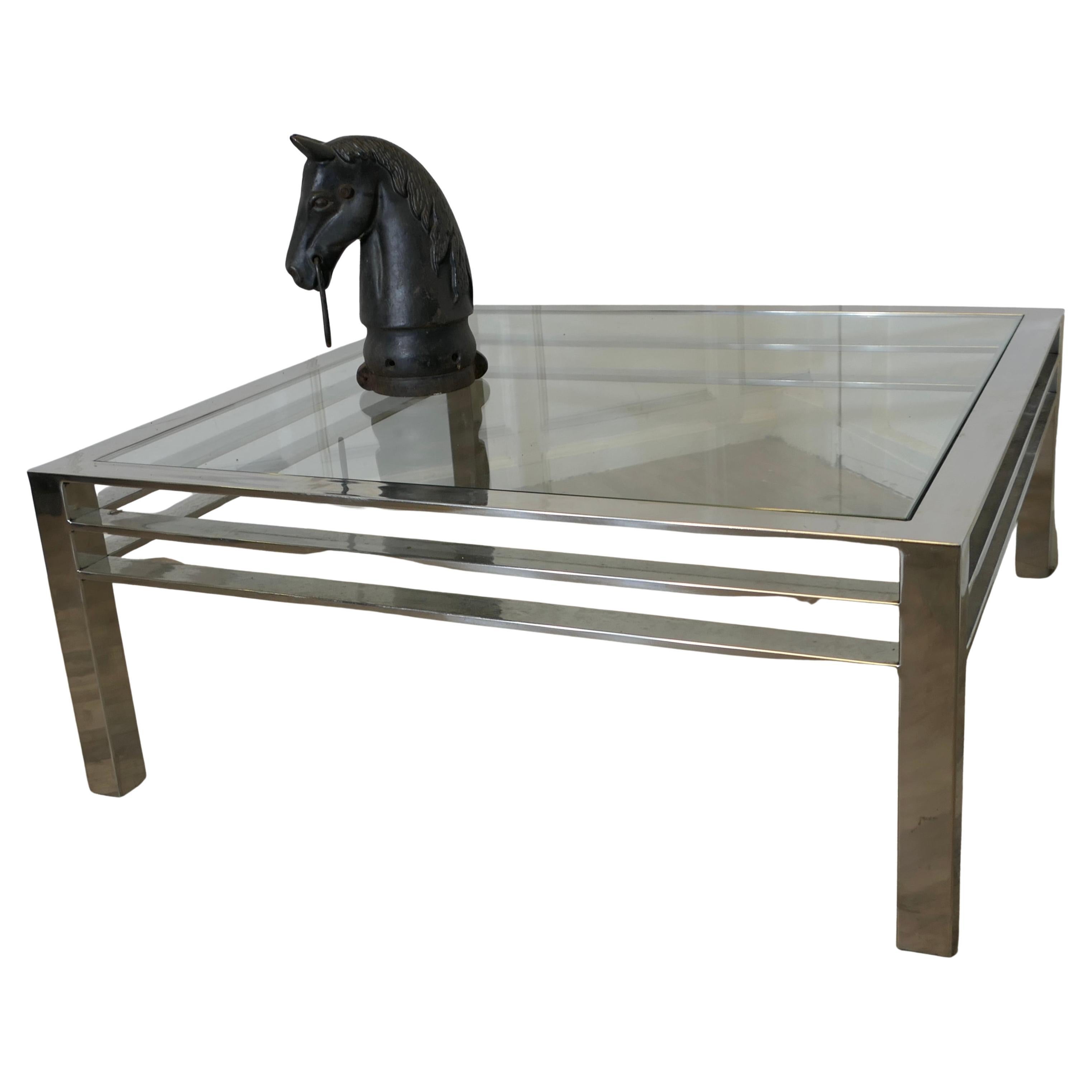 Modernist Chrome Coffee Table from the 1970s  
Large Mid Century Chrome and Glass Designer Coffee Table
This is a stylish piece, from the early 70s
A beautiful piece in good vintage condition
The Table is 16” high, 40” square
TZX425